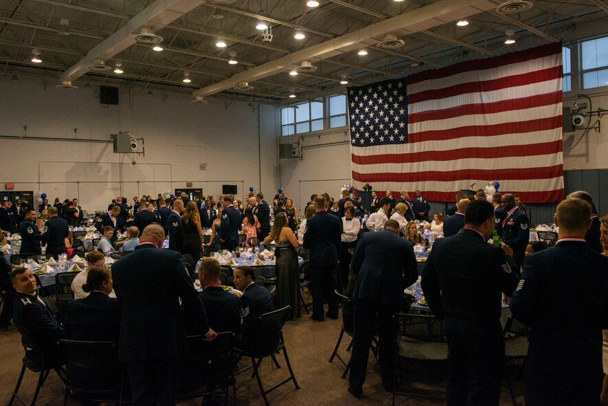 Members of Team Moody socialize during a senior NCO induction ceremony Aug. 28, 2015, at Moody Air Force Base, Ga. Attendees congratulated Moody’s future SNCOs during the ceremony. (U.S. Air Force photo by Airman 1st Class Dillian Bamman/Released)