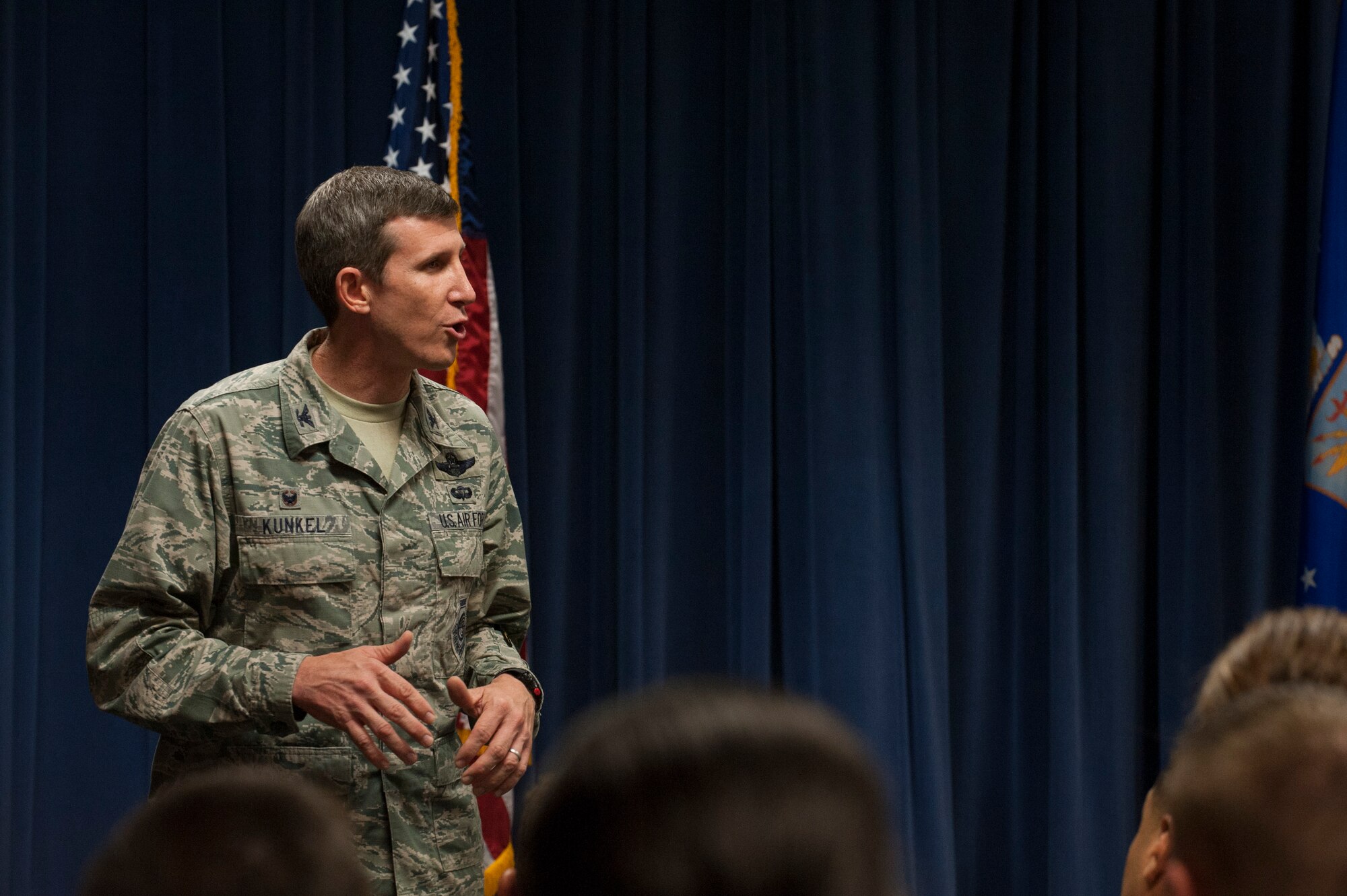 U.S. Air Force Col. Thomas Kunkel, 23d Wing commander, speaks during a senior NCO memento ceremony Aug. 28, 2015, at Moody Air Force Base, Ga. Kunkel asked the promotees to continue to mentor their Airmen and pursue professional development. (U.S. Air Force photo by Airman 1st Class Dillian Bamman/Released)