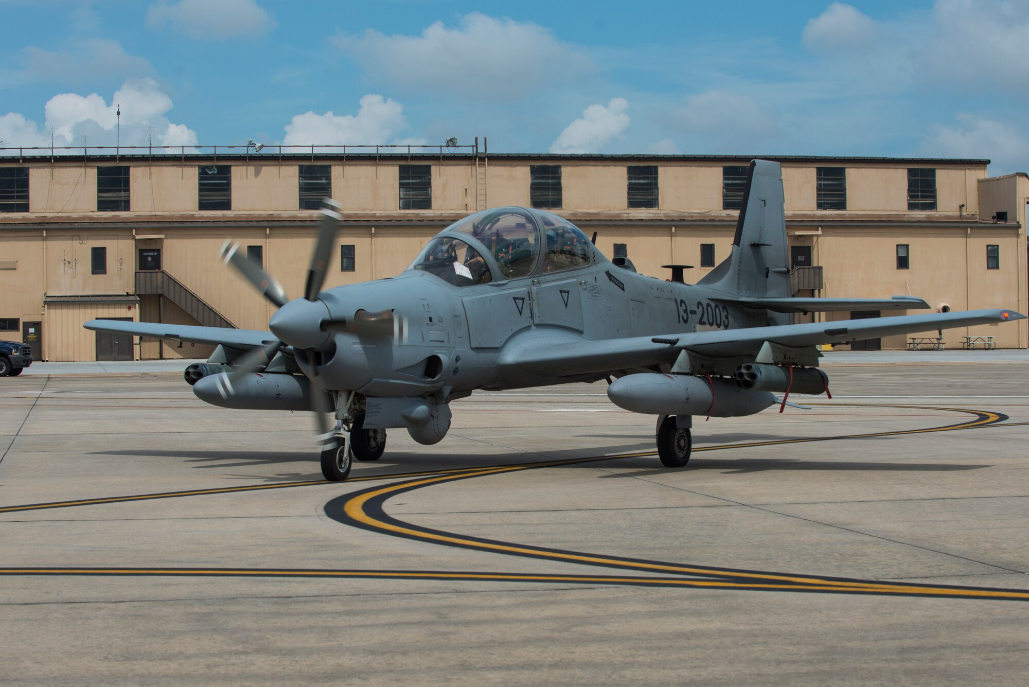 An A-29 Super Tucano taxis on the flightline after landing Sept. 1, 2015, at Moody Air Force Base, Ga.  U.S. Air Force Brig. Gen. John Cherrey, Air Education and Training Command director of intelligence, operations and nuclear integration, flew in the aircraft to witness the 81st Fighter Squadron’s Afghan air force flying training program. (U.S. Air Force photo by Airman 1st Class Dillian Bamman/Released)