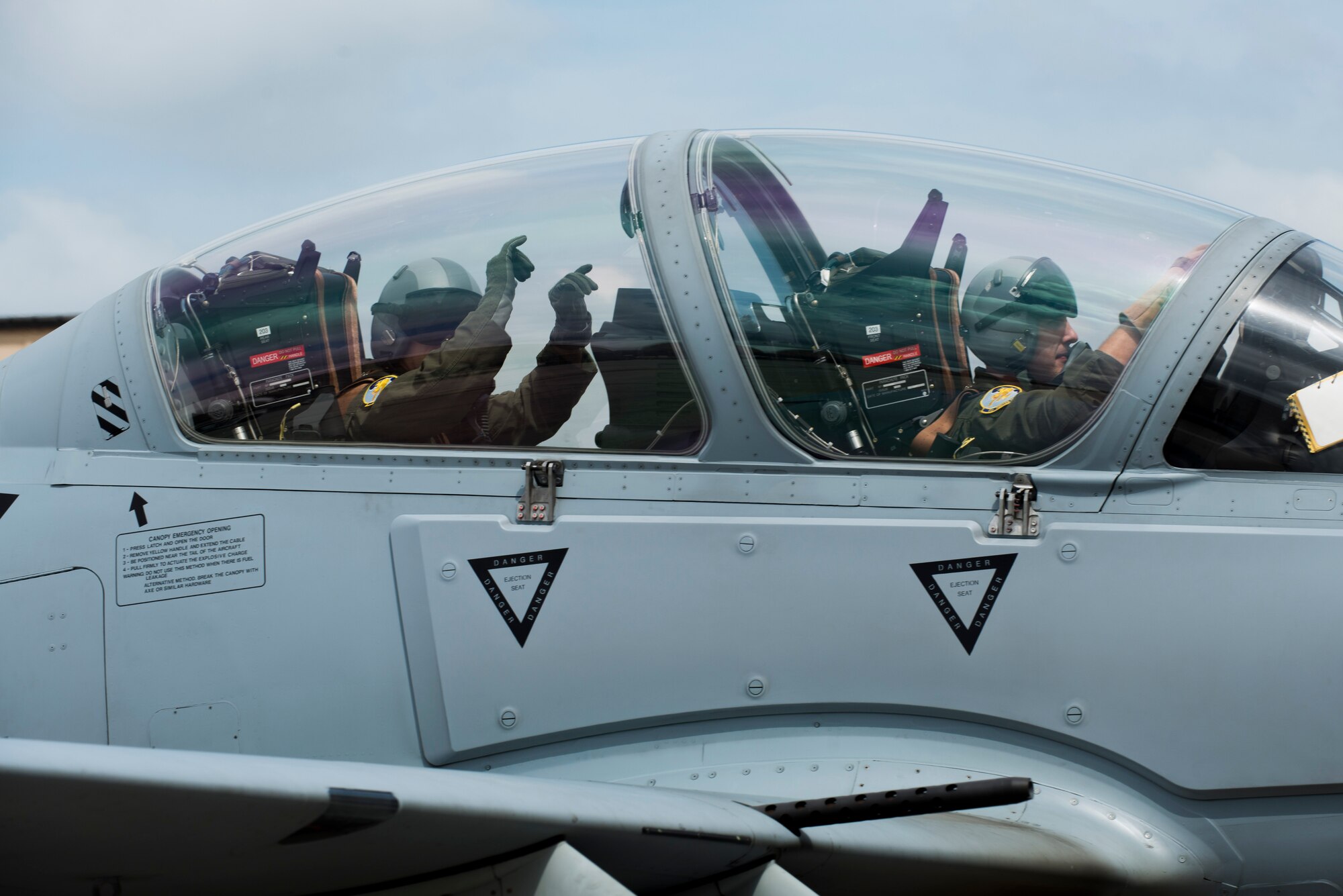 U.S. Air Force  Brig. Gen. John Cherrey (left),  Air Education and Training Command director of intelligence, operations and nuclear integration, poses for a photo in an A-29 Super Tucano Sept. 1, 2015, at Moody Air Force Base, Ga. Cherrey visited Moody to see how Airmen of the 81st Fighter Squadron conduct combat training for Afghan air force pilots and maintainers. (U.S. Air Force photo by Airman 1st Class Dillian Bamman/Released)