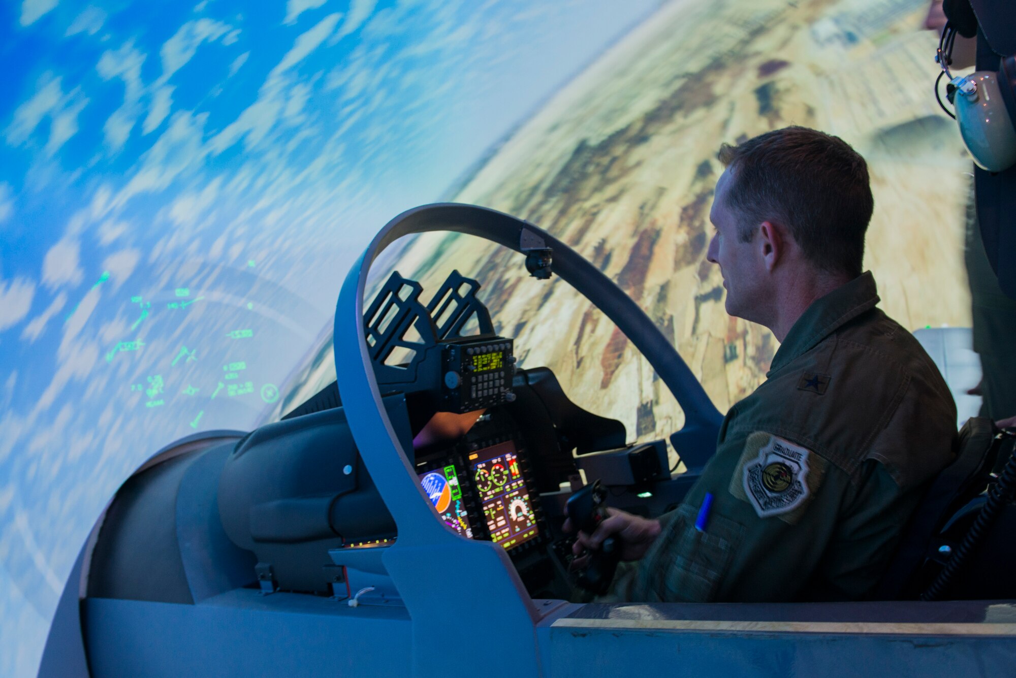 U.S. Air Force Brig. Gen. John Cherrey,  Air Education and Training Command director of intelligence, operations and nuclear integration, flies in the 81st Fighter Squadron’s A-29 simulator Aug. 31, 2015, at Moody Air Force Base, Ga. Cherrey visited Moody and spoke with the 81st Fighter Squadron’s Afghan air force pilots about their flying training program. (U.S. Air Force photo by Airman 1st Class Dillian Bamman/Released)