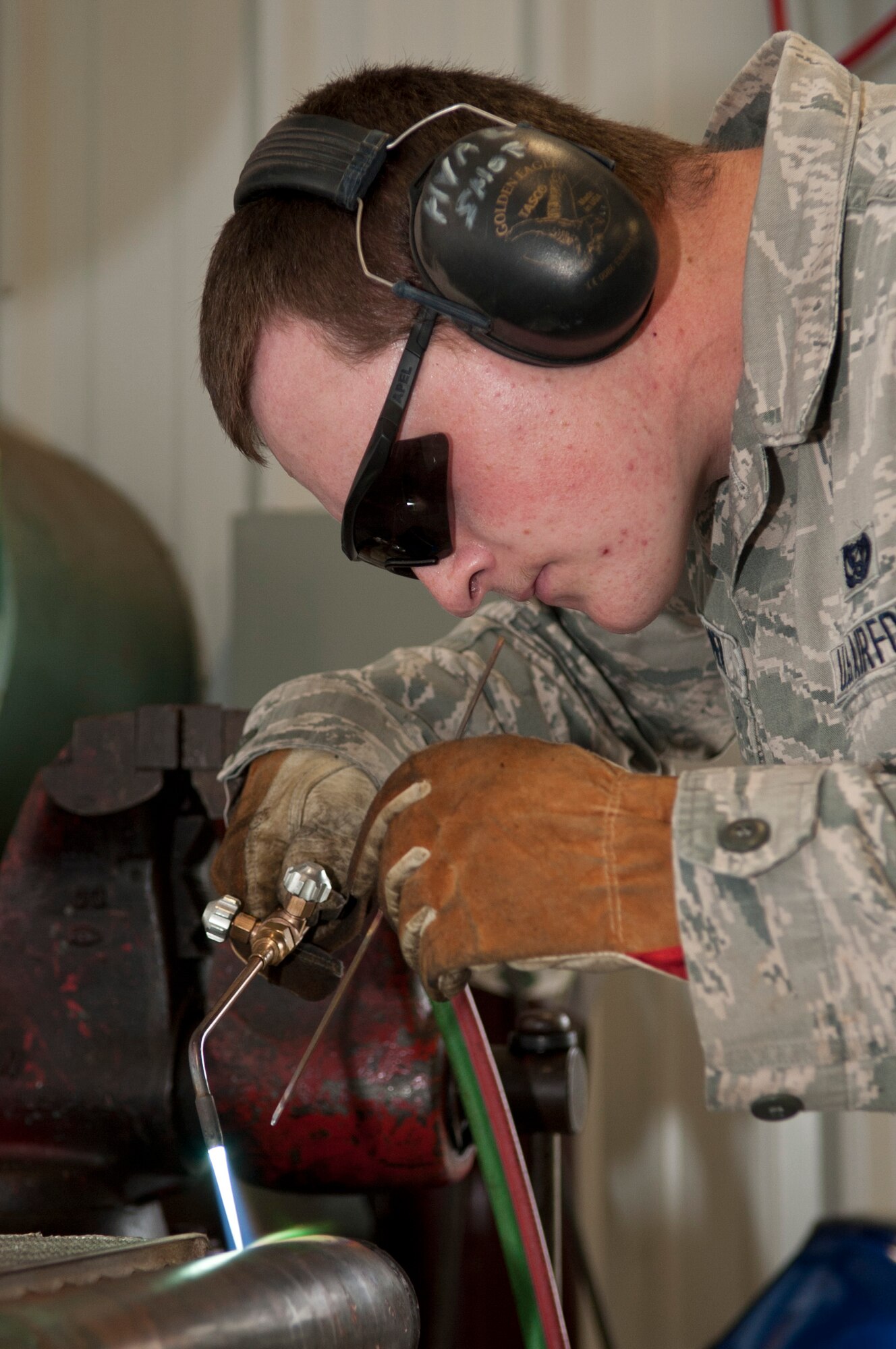 Senior Airman Matthew Kramer, 4th Civil Engineer Squadron heating, ventilation, and air conditioning technician, welds a piece of equipment, Sept. 2, 2015, at Seymour Johnson Air Force Base, North Carolina. During the last two years, several HVAC upgrades have been completed around the base, which save more than $60,000 per year. (U.S. Air Force photo/Airman 1st Class Shawna L. Keyes)