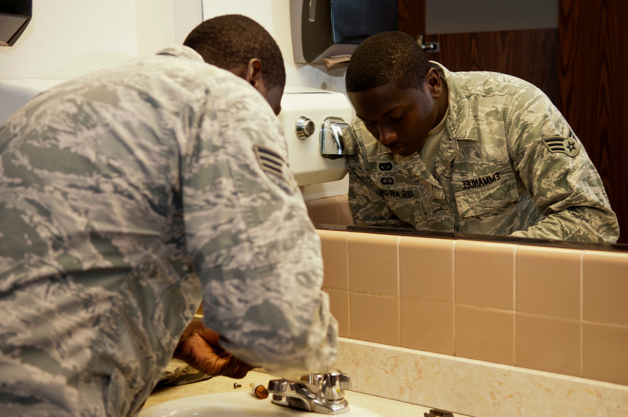 Senior Airman Eric Emmanuel, 4th Civil Engineer Squadron water and fuels systems maintenance technician, fixes a leaky sink, Sept. 2, 2015, at Seymour Johnson Air Force Base, North Carolina. Different shops within the 4th CES contributed to the squadron being awarded the 2015 Federal Energy & Water Management award. (U.S. Air Force photo/Airman 1st Class Shawna L. Keyes)