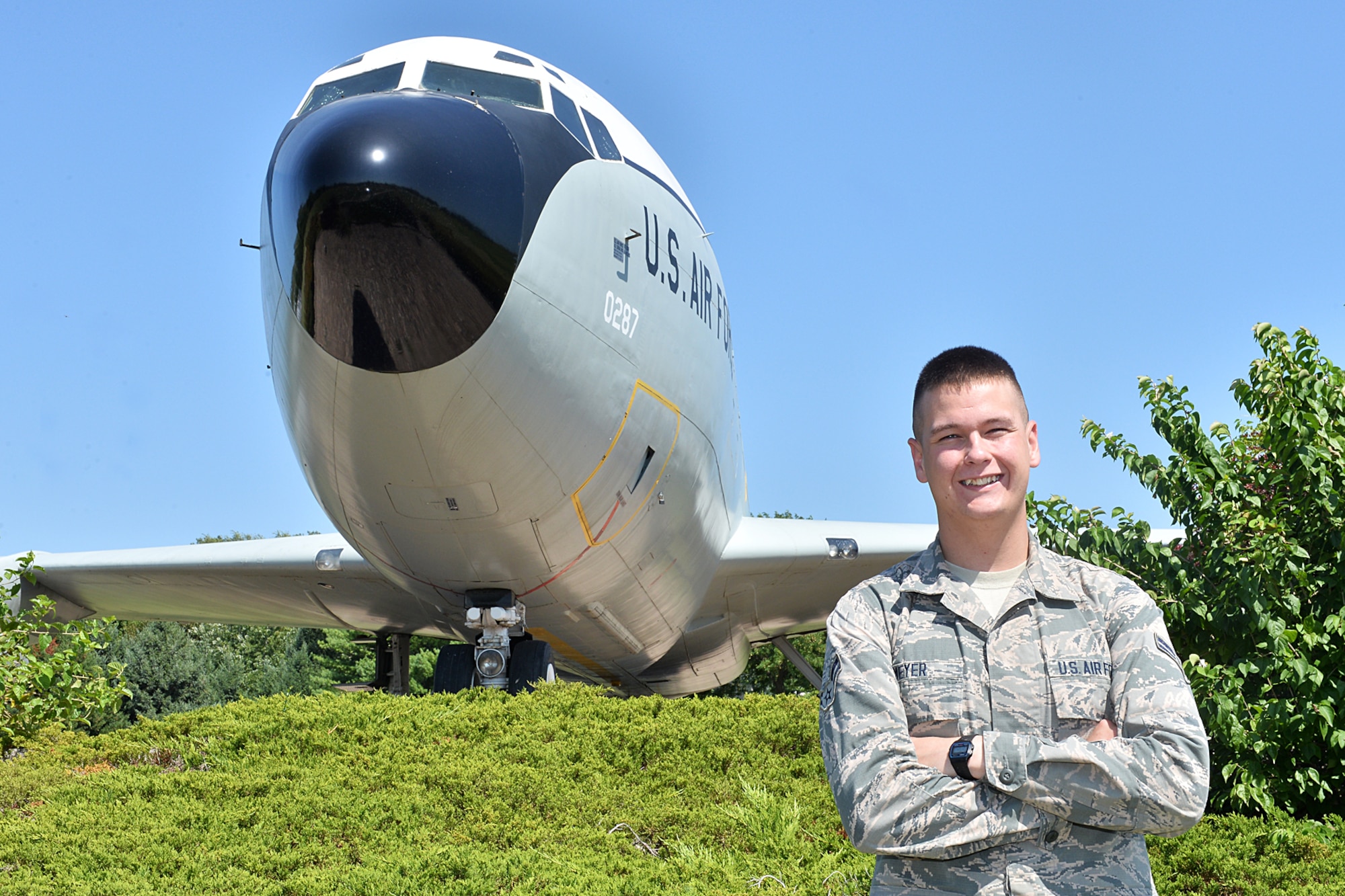 U.S. Air Force Airman 1st Class Daniel Meyer, 55th Aircraft Maintenance Squadron,  stands in front of an EC-135 Looking Glass static display Sept. 3. on Offutt Air Force Base, Neb.  Meyer has been at Offutt for a few months and has already made a lasting impression on his leadership. (U.S. Air Force photo by Charles Haymond)