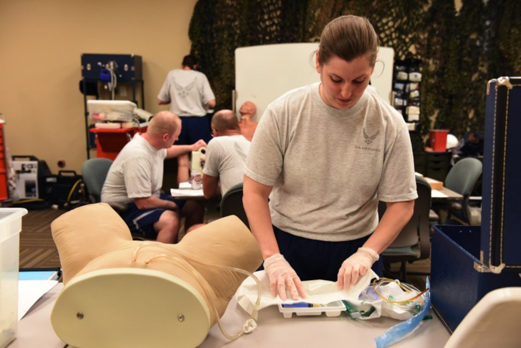 1st Lt. Jill Labowitz, 944th Aeromedical Staging Squadron clinical nurse, prepares to insert a catheter into a mock patient as part of a Readiness Skills Verification training Aug. 25. The RSV is part of a week-long Nursing Leadership Force Development Training. Along with medical related topics, the training also included performance report practice and preparation, team building exercises, defense travel system review and blues uniform inspection. (U.S. Air Force photo taken by Staff Sgt. Lausanne Kinder)
