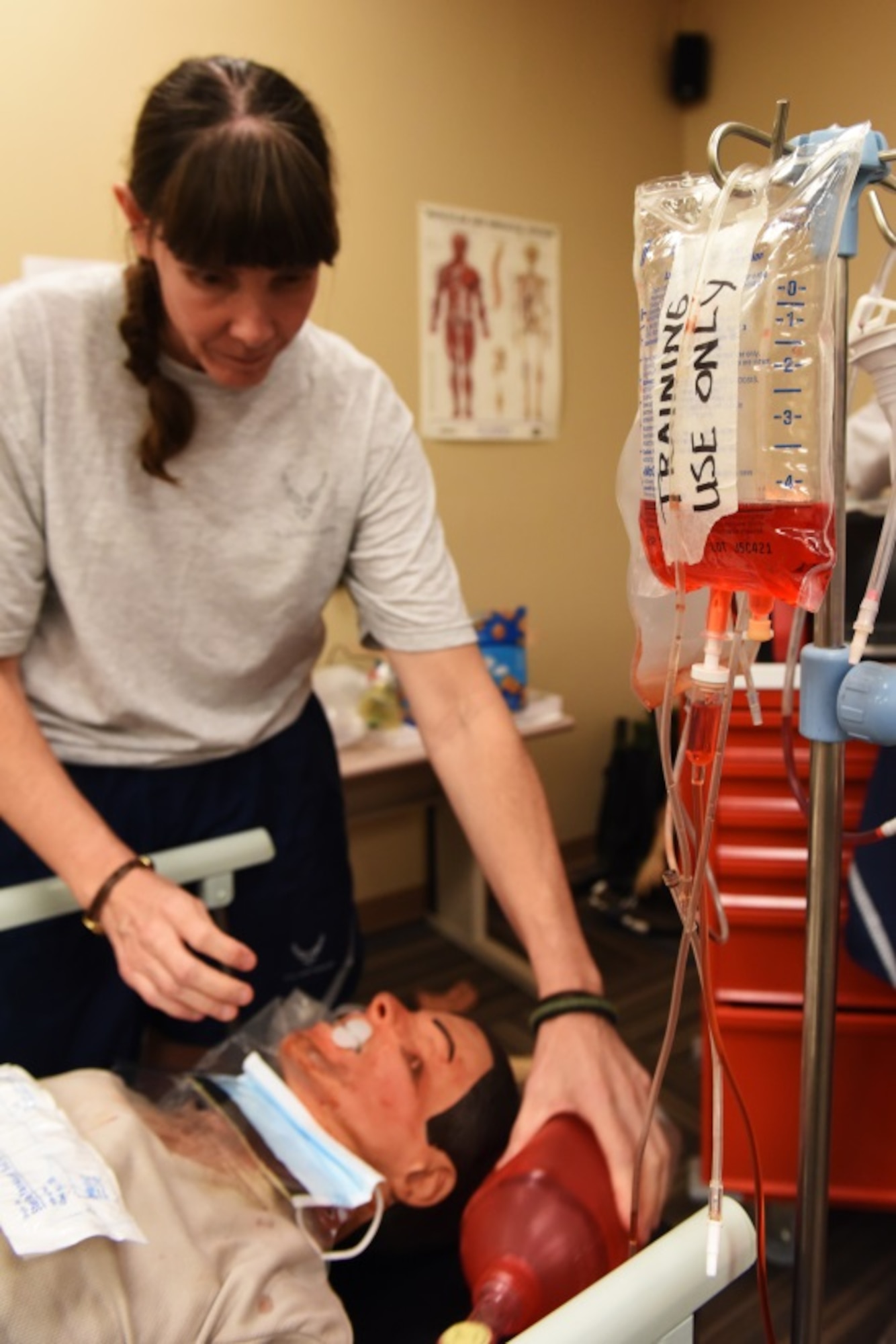 Lt. Col. Leslie Wilson, 944th Aeromedical Staging Squadron clinical nurse, prepares to resuscitate a dummy patient during a Readiness Skills Verification training Aug. 25. The RSV is part of a week-long Nursing Leadership Force Development Training. Along with medical related topics, the training also included performance report practice and preparation, team building exercises, defense travel system review and blues uniform inspection. (U.S. Air Force photo taken by Staff Sgt. Lausanne Kinder)