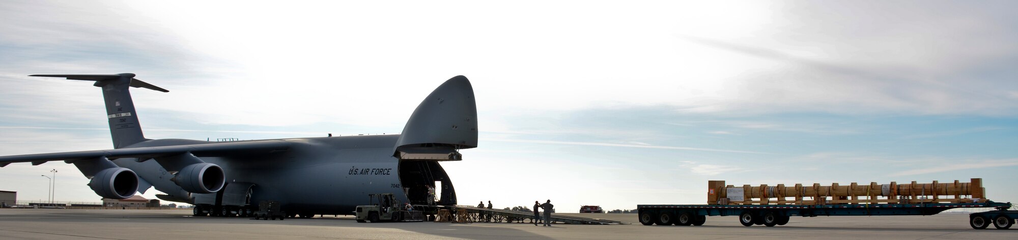 A C-5M Super Galaxy is loaded Aug. 28 at Travis Air Force Base, California. The Navy propeller shaft will ship to Japan as the third shaft of three to be transported for the USS Shiloh, which is currently in dry dock. (U.S. Air Force photo by Airman 1st Class Amber Carter)