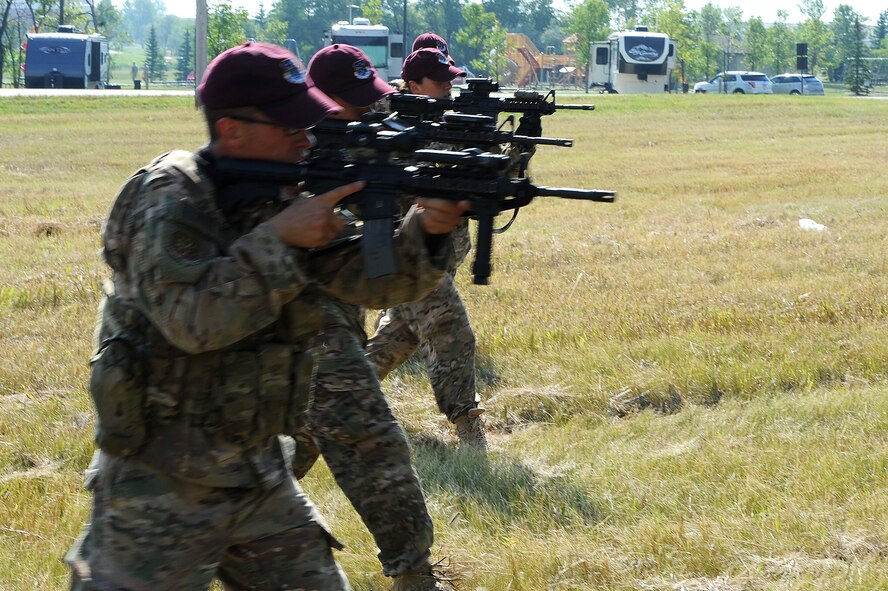 Members of the 91st Security Forces Group Global Strike Challenge team walk in a formation during tactical training at Minot Air Force Base, N.D., Sept. 2, 2015. To train for the GSC, the team has been doing physical and mental training every day, as well as working on their tactics and teamwork. (U.S. Air Force photo / Senior Airman Kristoffer Kaubisch)