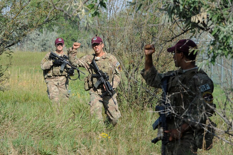 Senior Airman Cody Poole, 91st Security Forces Group Global Strike Challenge team, lays prone during tactical training at Minot Air Force Base, N.D., Sept. 2, 2015. To train for the GSC, the team has been doing physical and mental training every day, as well as working on their tactics and teamwork. (U.S. Air Force photo / Senior Airman Kristoffer Kaubisch)