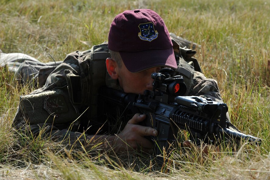 Senior Airman Brandon Weese, 91st Security Forces Group Global Strike Challenge team, lays prone during tactical training at Minot Air Force Base, N.D., Sept. 2, 2015. To train for the GSC, the team has been doing physical and mental training every day, as well as working on their tactics and teamwork. (U.S. Air Force photo / Senior Airman Kristoffer Kaubisch)