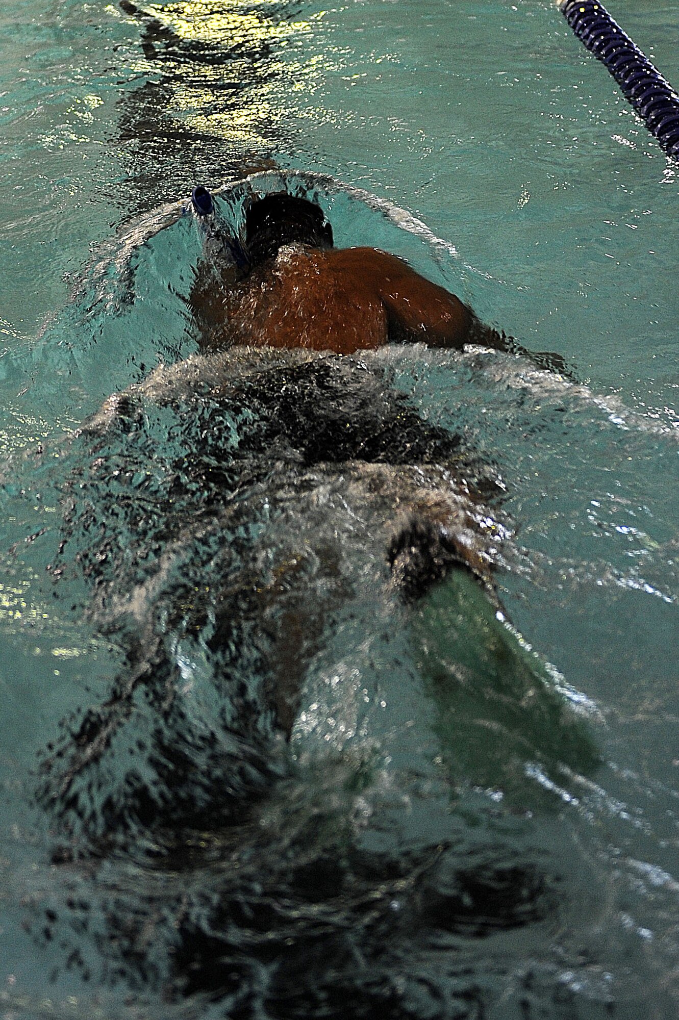 1st Lt. Kschristopher Anda, 91st Security Forces Group Global Strike Challenge team, swims laps at Minot Air Force Base, N.D., Sept. 1, 2015. As one of the team captains for the 91st SFG GSC team, Anda is pushing his team mentally and physically every day to train for the upcoming competition.  (U.S. Air Force photo / Senior Airman Kristoffer Kaubisch)   