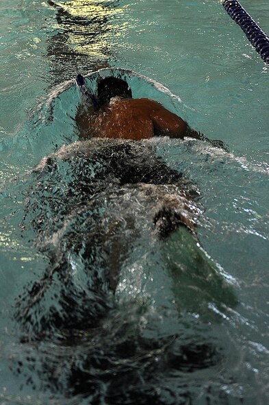1st Lt. Kschristopher Anda, 91st Security Forces Group Global Strike Challenge team, swims laps at Minot Air Force Base, N.D., Sept. 1, 2015. As one of the team captains for the 91st SFG GSC team, Anda is pushing his team mentally and physically every day to train for the upcoming competition.  (U.S. Air Force photo / Senior Airman Kristoffer Kaubisch)   