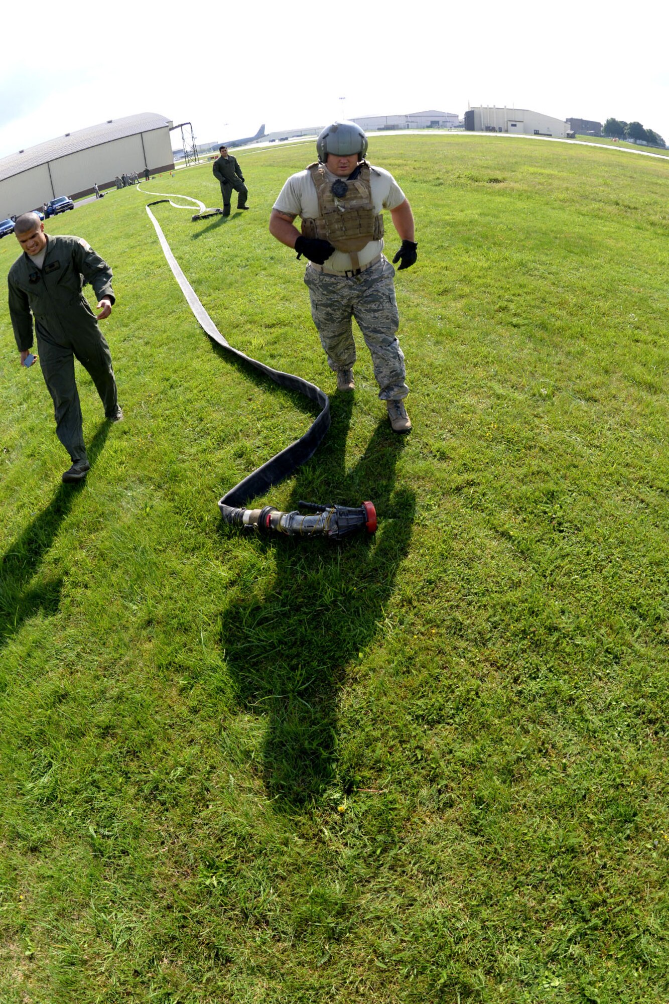 U.S. Air Force Tech. Sgt. Jeffrey Wright, 100th Logistics Readiness Squadron fuels information service center section chief, runs to complete a portion of tryouts for the Forward Area Refueling Point team Sept. 3, 2015, on RAF Mildenhall, England. The rigorous tryouts were designed to test Airmen for a worst-case scenario when performing FARP duties to ensure they could handle tasks under stress and in potentially dangerous areas. Utilized mostly in potentially hazardous areas, a FARP is the process of refueling aircraft on the ground from another parked aircraft. (U.S. Air Force photo by Senior Airman Kate Thornton/Released)