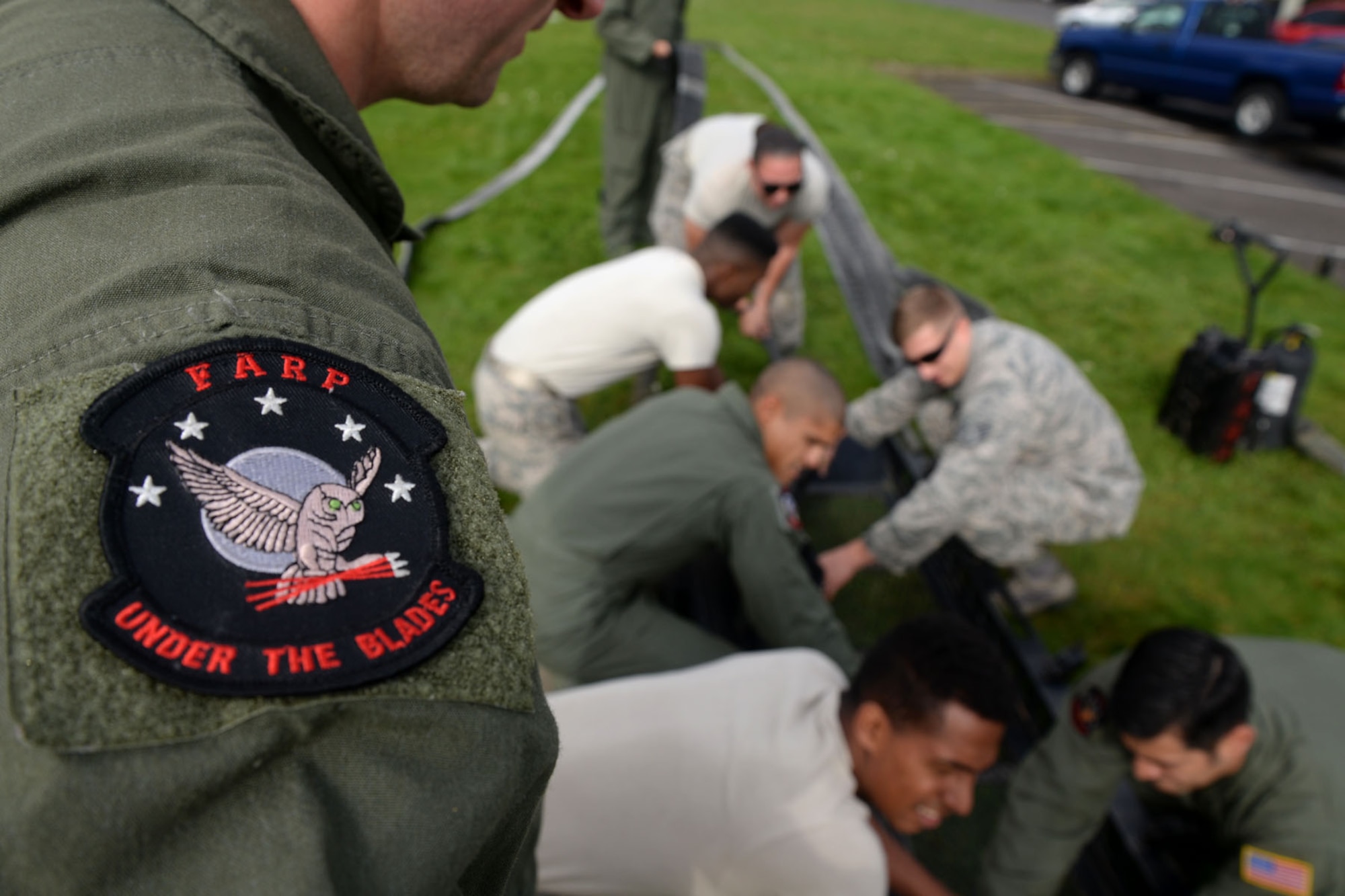 U.S. Air Force Airmen assigned to the 100th Logistics Readiness Squadron Fuels Management Flight prepare for tryouts for the Forward Area Refueling Point team Sept. 3, 2015, on RAF Mildenhall, England. The nine Airmen currently assigned to the FARP team conduct missions alongside the 352nd Special Operations Wing to refuel aircraft in austere and potentially dangerous areas. FARP is the process of refueling aircraft on the ground from another parked aircraft. (U.S. Air Force photo by Senior Airman Kate Thornton/Released)