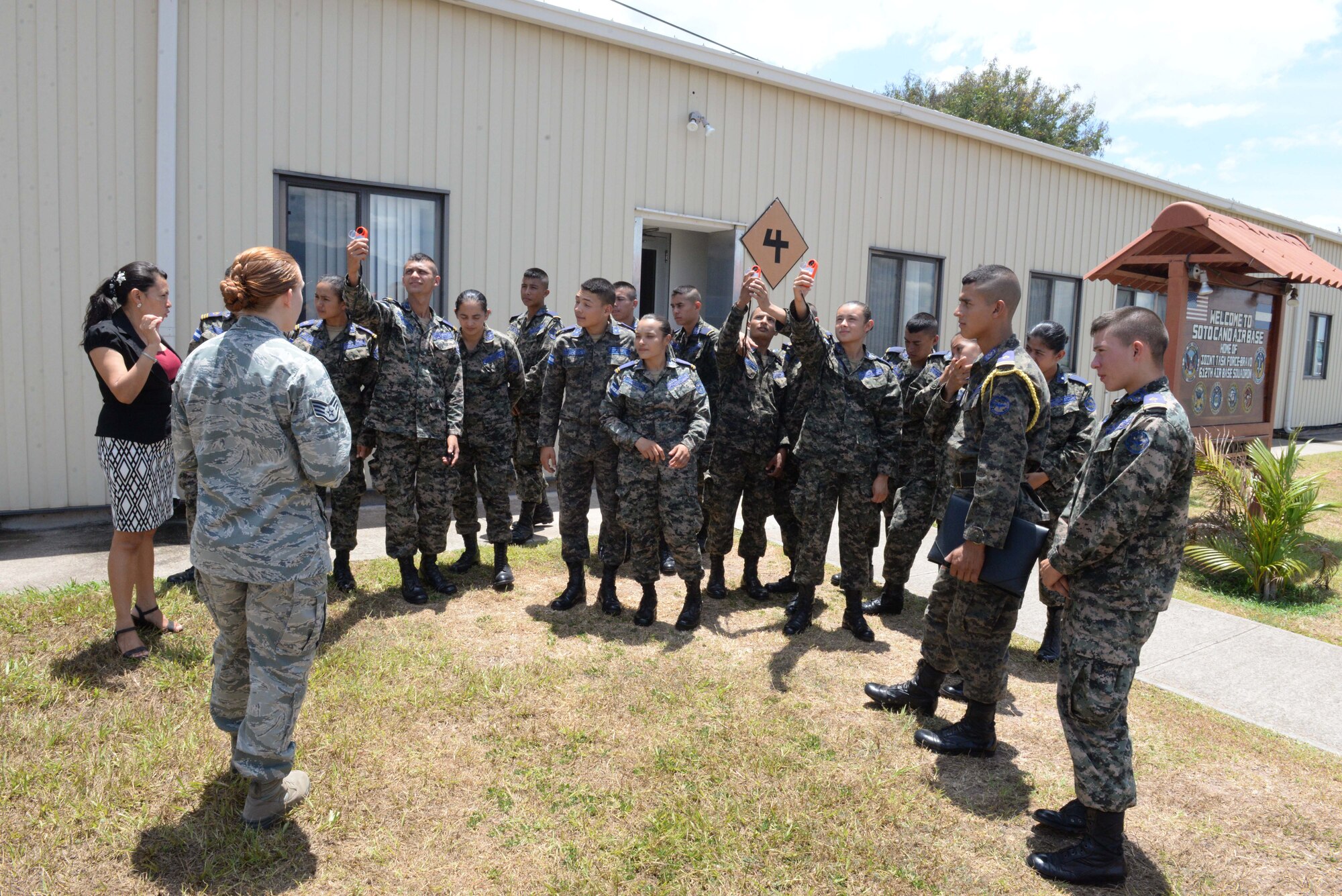 Staff Sgt. Alicia Freedman, a 612th Air Base Squadron weather forecaster, demonstrates the use of kestrels, hand-held weather meters, to members of the Honduran Air Force during Honduran Non-Commissioned Officer Day Sept. 1, 2015, at Soto Cano Air Base, Honduras. The event was organized to increase partnership capacity and teach the importance of camaraderie and teamwork between nations. (U.S. Air Force photo by Staff Sgt. Jessica Condit)