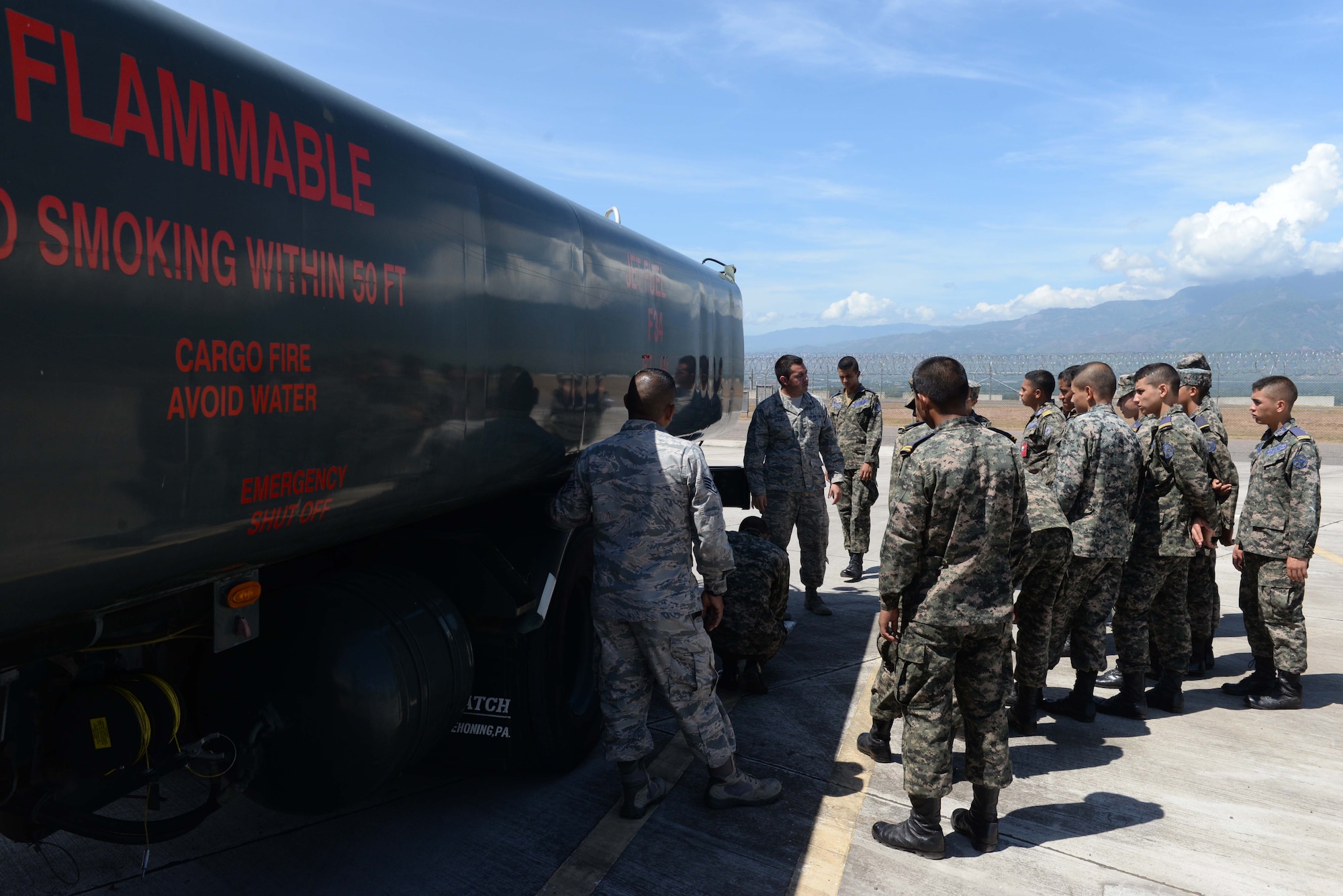 Senior Airman James Gomez, a 612th Air Base Squadron fuels technician, briefs Honduran Air Force service members during Honduran Non-Commissioned Officer Day Sept. 1, 2015, at Soto Cano Air Base, Honduras. The briefing was a stop at one of six locations where U.S. Air Force service members shared their knowledge with Honduran service members in order to encourage bi-lateral familiarity and build partnerships. (U.S. Air Force photo by Staff Sgt. Jessica Condit)