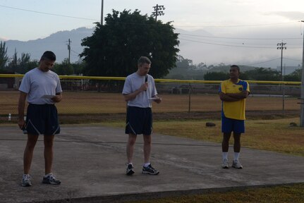 Lt. Col. James Wandmacher, 612th Air Base Squadron commander, kicks off Honduran Non-Commissioned Officer Day with a few words of encouragement for the Honduran and U.S. Air Forces, Sept. 1, 2015, at Soto Cano Air Base, Honduras. The day started with sporting events, teaching both air forces the lasting impact that camaraderie has on partnership and foreign relations. (U.S. Air Force photo by Staff Sgt. Jessica Condit)