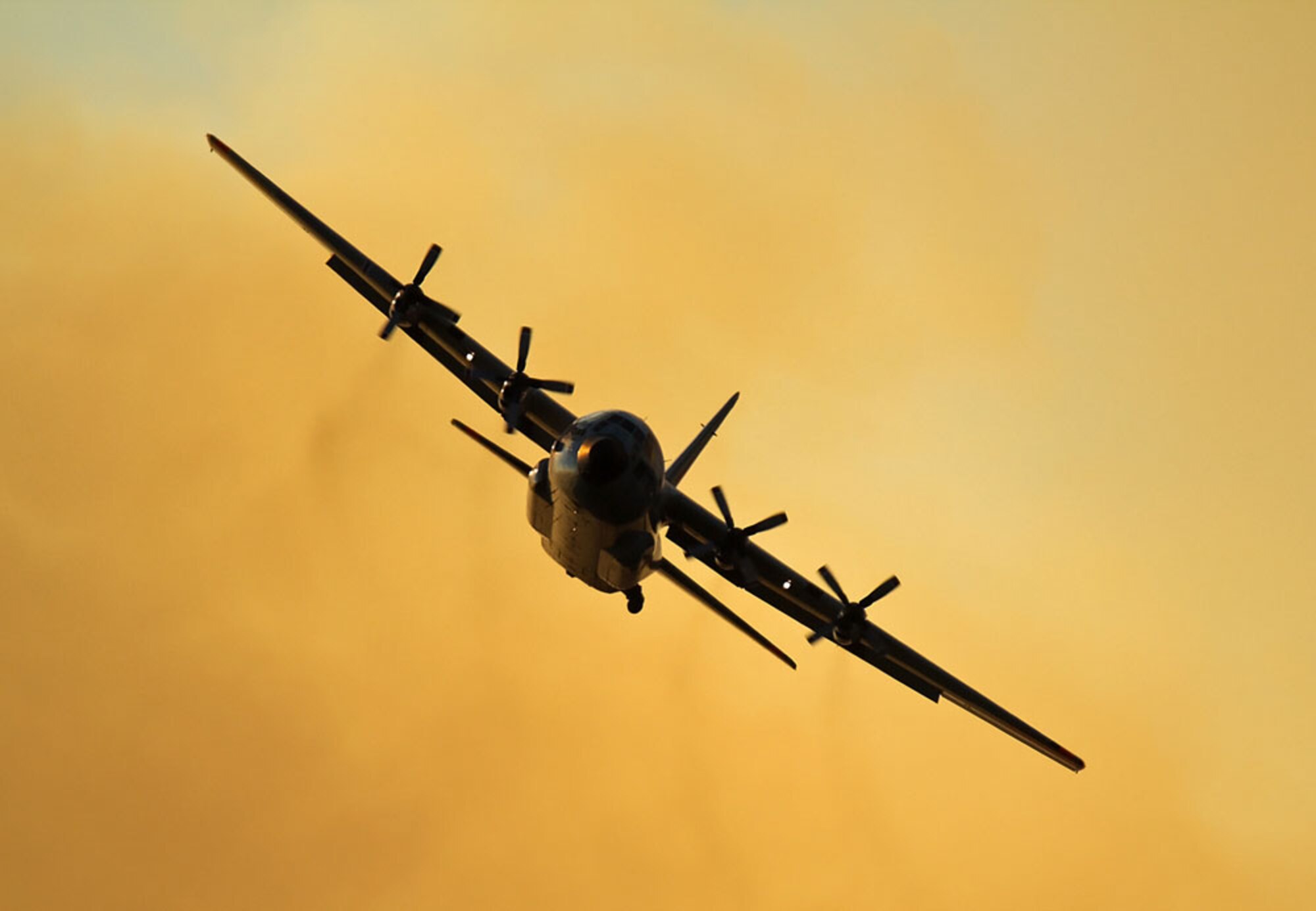 HC-130H aircraft releasing fire retardant over fire.


2401_LowellFire_T118