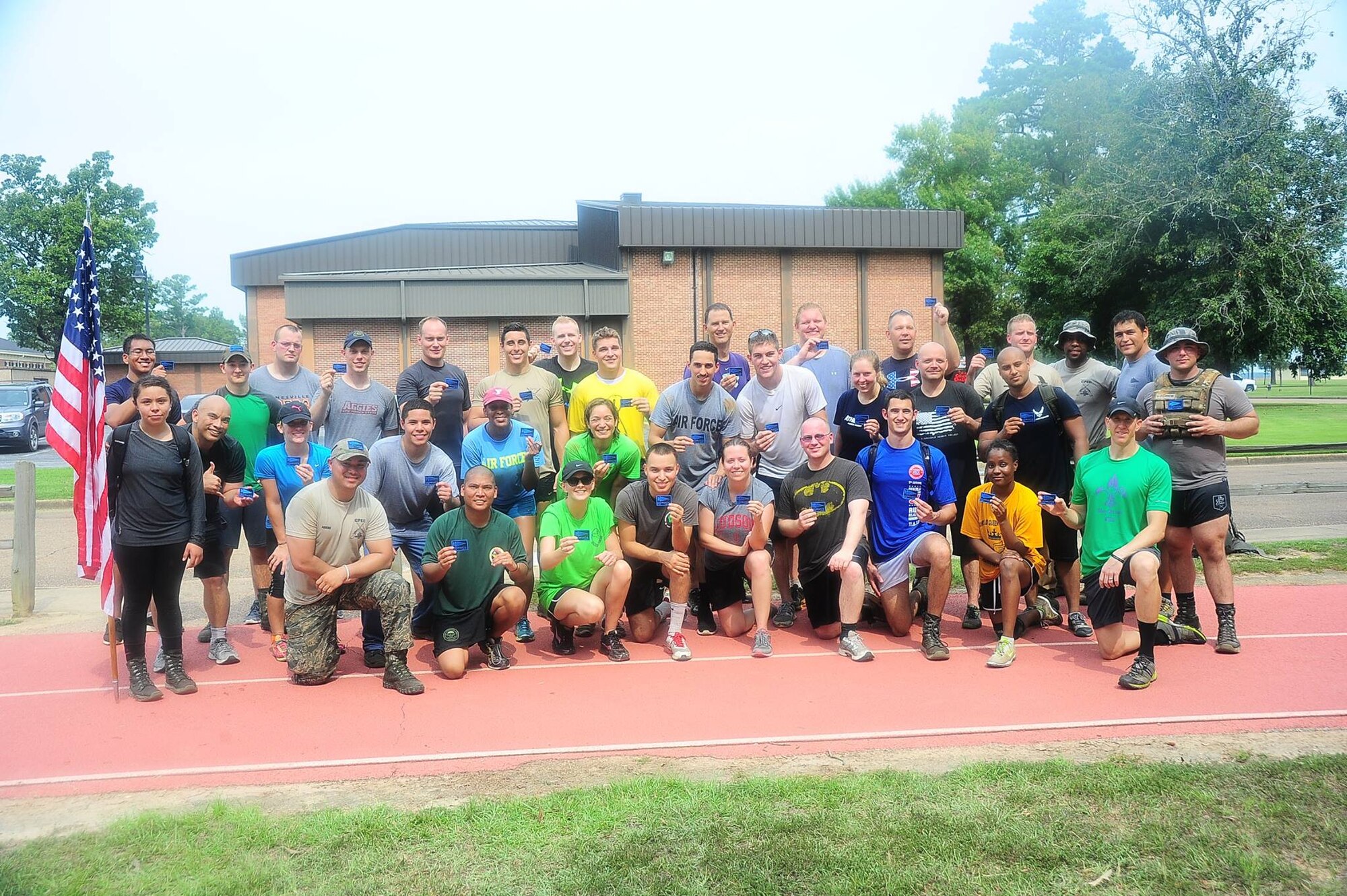 More than 30 Team BLAZE members that participated in the Team Cohesion Challenge stand together after completing the challenge Sept. 2 on Columbus Air Force Base, Mississippi. The athletes ran between 7 and 10 miles and completed numerous exercises and teamwork events over the span of 5 hours. (U.S. Air Force photo/Airman 1st Class Daniel Lile)