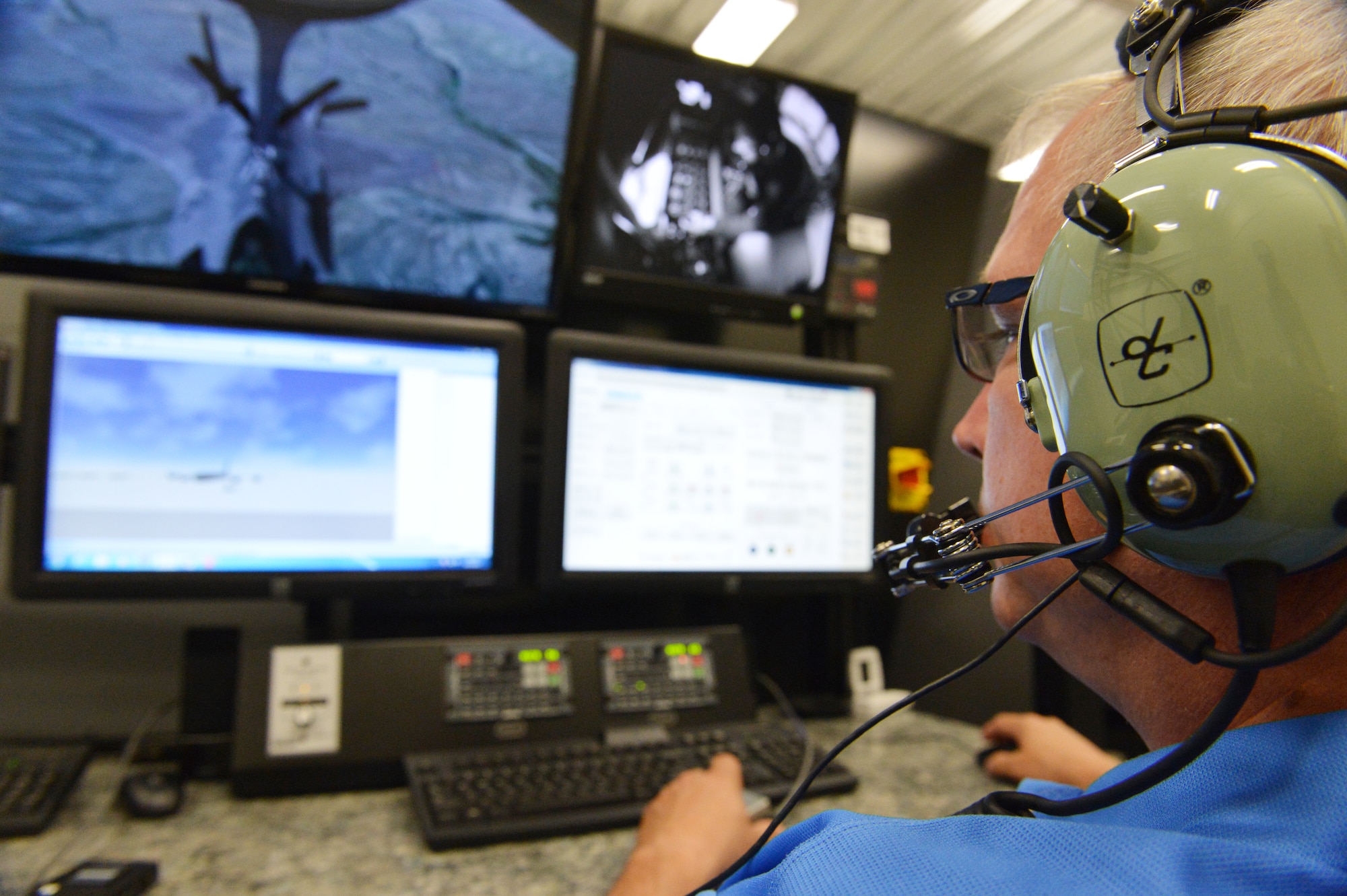 Nebraska Air National Guard boom operators hone their skills refueling aircraft in the newly acquired boom operator simulator located at the 155th Air Refueling Wing, Lincoln, Neb., Aug. 25. The Nebraska Air Guard is the first Guard unit to receive the BOSS 59-1495. (U.S. Air Force photo Staff Sgt. Mary Thach)