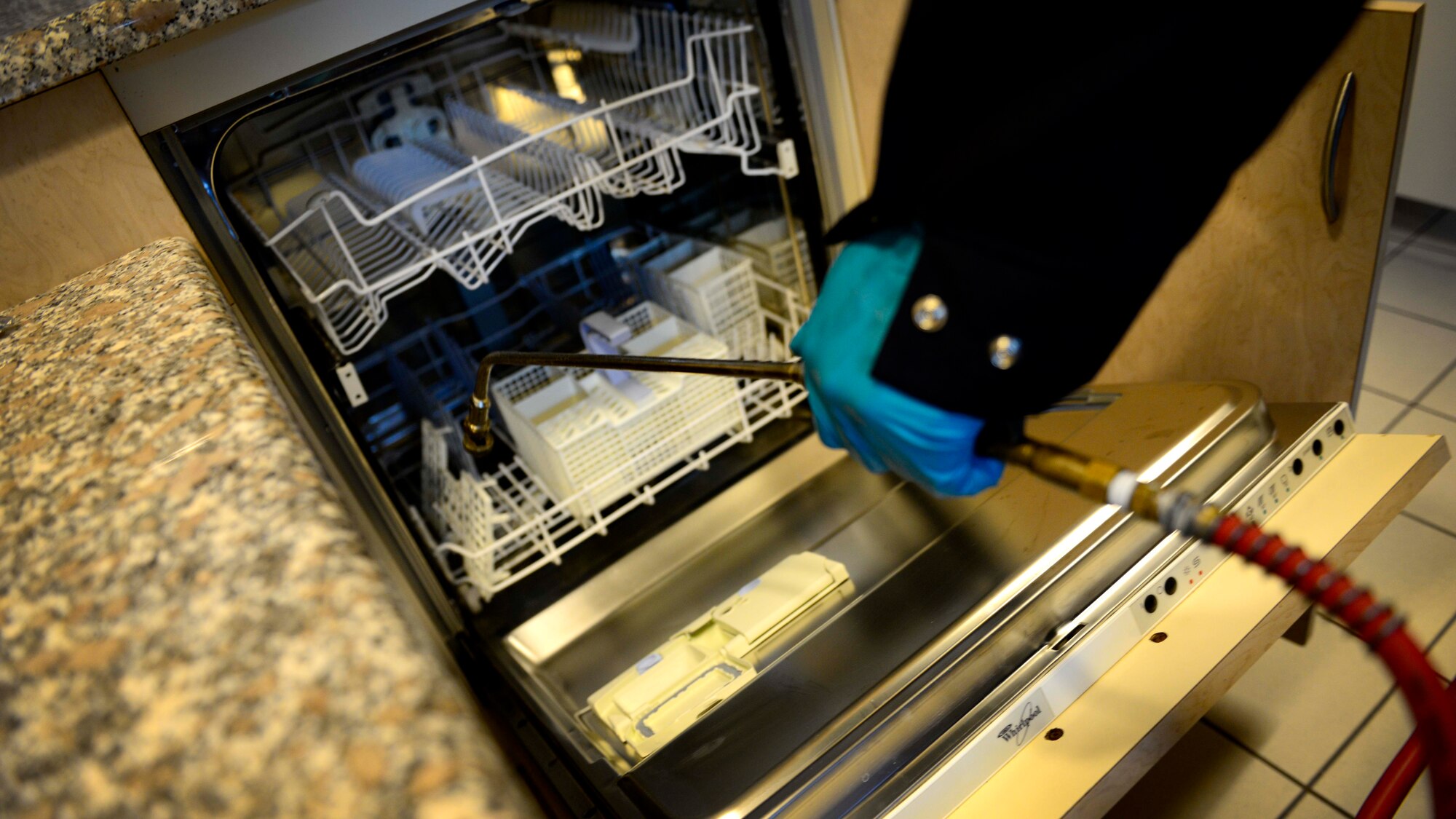 U.S. Air Force Staff Sgt. Aaron Pass, 31st Civil Engineer Squadron Pest Management NCO in charge, sprays pesticides, Sept. 2, 2015, at the Mountain View Lodge on Aviano Air Base, Italy. The pest management flight aims to prevent vermin and vegetation from adversely affecting Team Aviano. (U.S. Air Force photo by Senior Airman Areca T. Bell/Released)