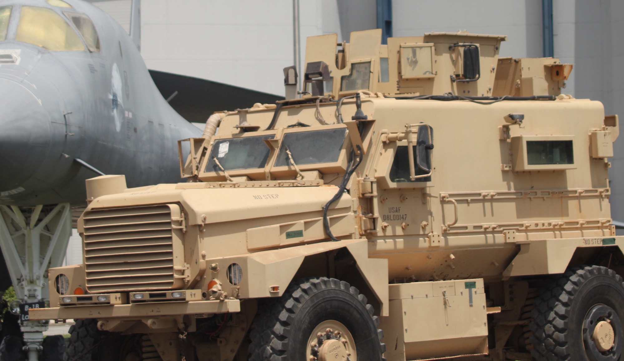 This Mine Resistant Ambush Protected Cougar is one of the newest vehicle assets at the Museum of Aviation. This particular MRAP took a bomb blast in January 2014, that caused heavy damage, yet none of the troops inside were injured. (U.S. Air Force photo by Angela Woolen)