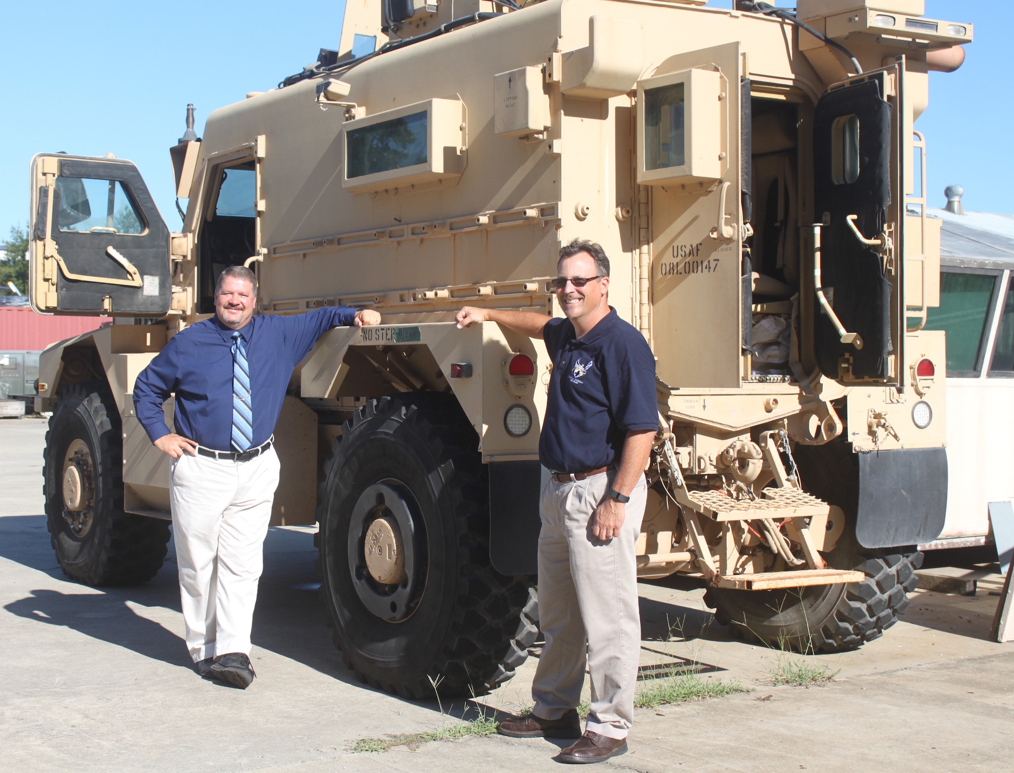 From left, Ed Jones, Air Force Life Cycle Management Center Support Equipment and Vehicles Division operations director, and Ted Hecker, AFLCMC MRAP logistics manager, take time off from the sustainment and acquisition work they do each day to take a tour of the museum’s new MRAP, which is sustained here. (U.S. Air Force photo by Angela Woolen)