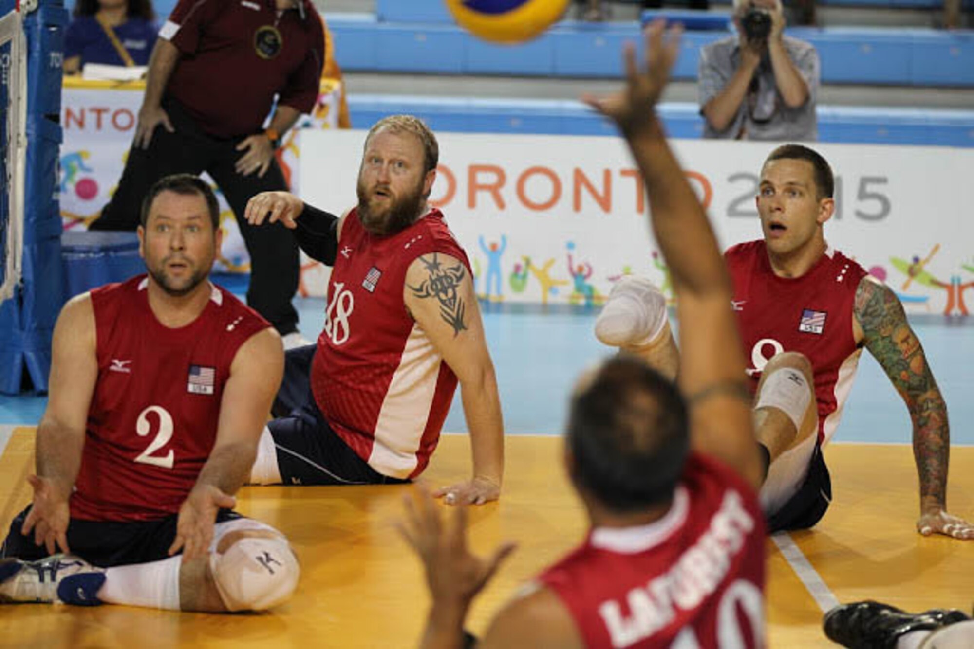 J. Dee Marinko, No. 18 in the center, is a member of the Team USA sitting volleyball team. The five-year veteran player recently competed with the team at the international Parapan American Games in Toronto, where they earned a silver medal. With the second place finish, the team qualified for the worldwide 2016 Paralympic Games in Rio de Janeiro. Marinko, who had his foot amputated six years ago, is a forward logistics specialist with the 565th Aircraft Maintenance Squadron. (Photo courtesy of USAV/John Kessel)/Released

