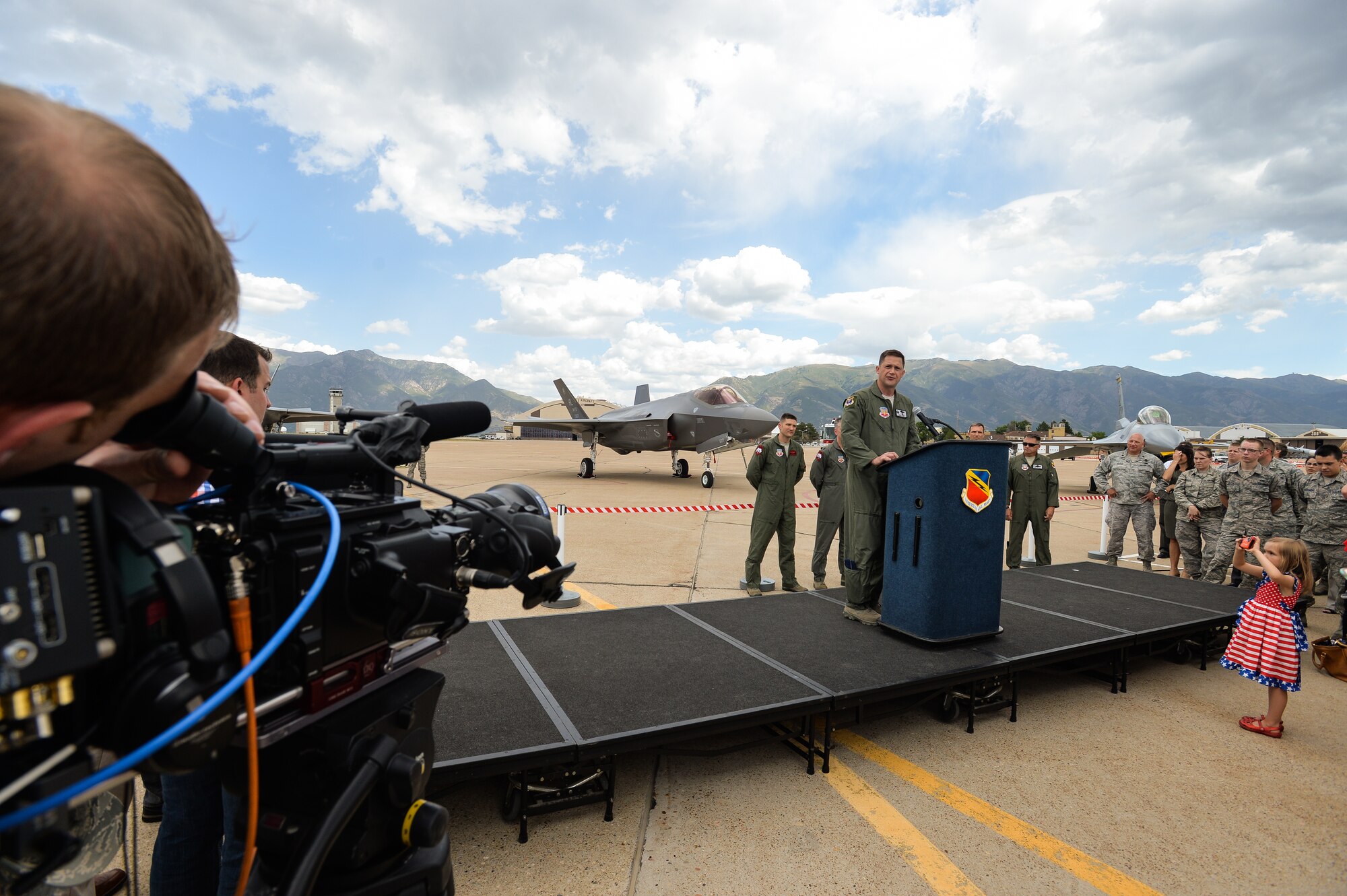 Col. David Lyons, 388th Fighter Wing commander, speaks to Airmen, family members, civic leaders and media after delivering an operational F-35A Lightning II aircraft to Hill Air Force Base, Utah, Sept. 2, 2015. Lyons, along with Lt. Col. Yosef Morris, 34th Fighter Squadron director of operations, delivered the first two jets, known as AF-77 and AF-78, at approximately 1 p.m. MDT after a 90-minute flight from the F-35 production facility in Fort Worth, Texas.  These aircraft are the first two of up to 72 jets that will be assigned to both the active-duty 388th and Reserve 419th Fighter Wings at Hill. (U.S. Air Force photo by Ron Bradshaw/Released)