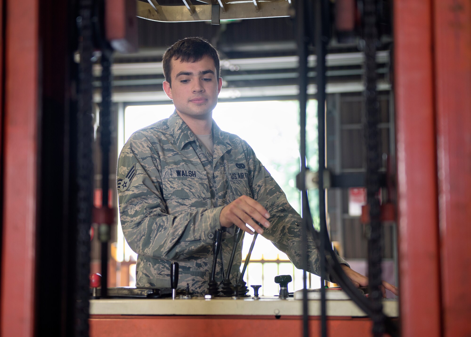 Senior Airman Brandon Walsh, 374th Logistics Readiness Squadron outbound specialist, operates a forklift at Yokota Air Base, Japan, Sept. 2, 2015. The 374 LRS Traffic Management Office’s outbound cargo section is responsible for shipping out government cargo to include aircraft parts and other mission essential items to bases worldwide. (U.S. Air Force photo by Airman 1st Class Delano Scott/Released)
