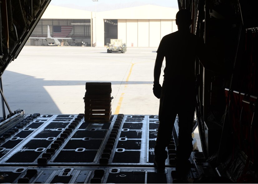 U.S. Air Force Staff Sgt. Casey Strauss, 774th Expeditionary Airlift Squadron C-130J Super Hercules aircraft loadmaster, opens the back of an aircraft in preparation for cargo loading Aug. 28, 2015 at Bagram Airfield, Afghanistan. Strauss, who is a part of the ‘1000s of Hands’ project, is responsible for on-loading and offloading mission essential goods throughout Afghanistan as well as ensuring the safety of passengers and crew members during flight. (U.S. Air Force photo by Senior Airman Cierra Presentado/Released)
