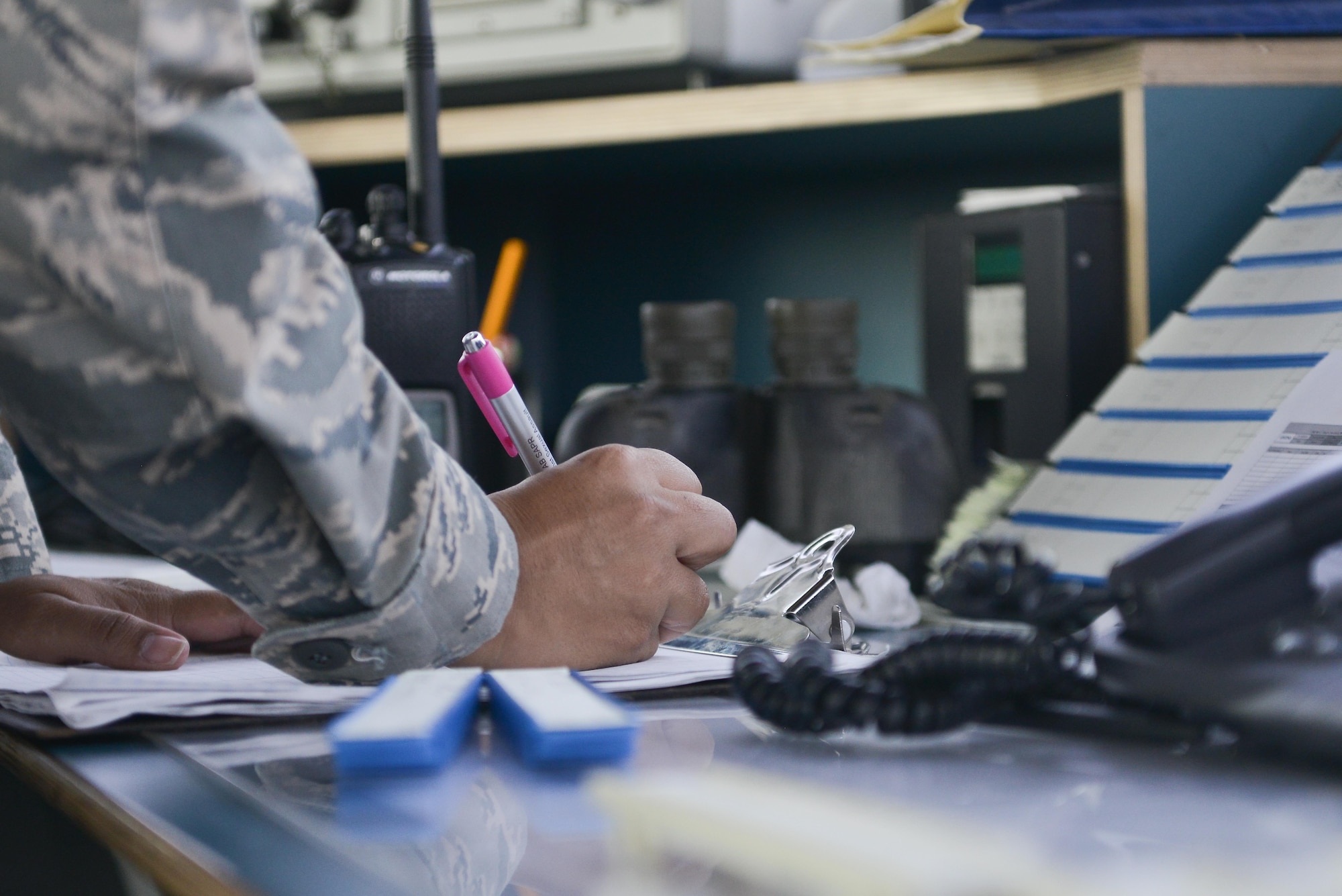 Tech. Sgt. Kelena Hendricks, 379th Expeditionary Operations Support Squadron air traffic controller, updates her progress strips with departing aircraft September 2, 2015 at Al Udeid Air Base, Qatar. U.S. Air Force air traffic controllers deployed to Al Udeid Air Base remain in constant contact with coalition aircraft departing and entering the base’s airspace while working side-by-side with Qatari military ATC. (U.S. Air Force photo/Staff Sgt. Alexandre Montes)