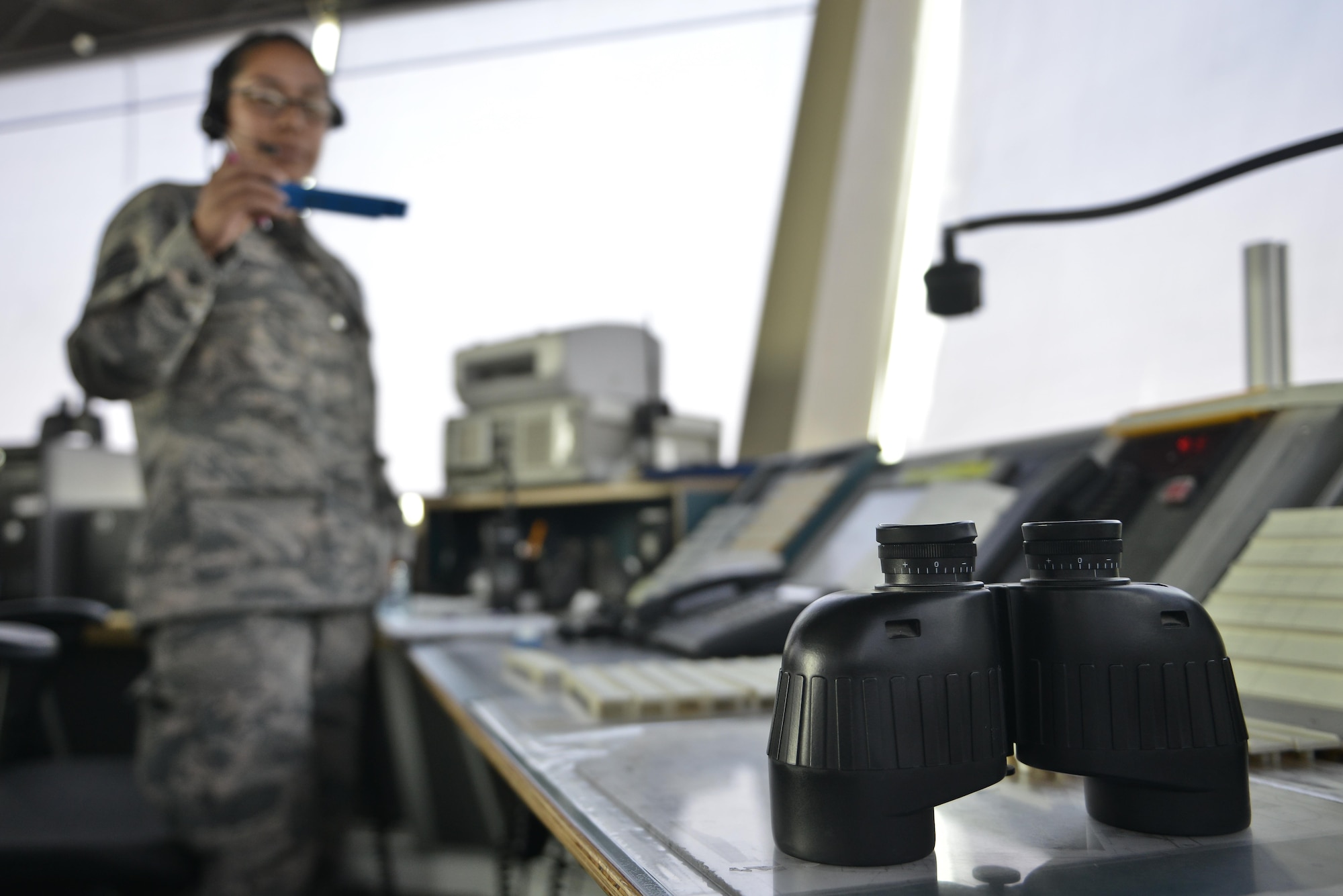 Tech. Sgt. Kelena Hendricks, 379th Expeditionary Operations Support Squadron air traffic controller, talks to aircrew preparing for departure September 2, 2015 at Al Udeid Air Base, Qatar. U.S. Air Force air traffic controllers deployed to Al Udeid Air Base remain in constant contact with coalition aircraft departing and entering the base’s airspace while working side-by-side with Qatari military ATC. (U.S. Air Force photo/Staff Sgt. Alexandre Montes)