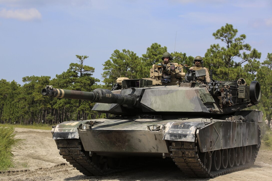 Marines with Alpha Company, 2nd Tank Battalion, arrive at Landing Zone Dodo to meet Marines with Golf Company, 2nd Battalion, 2nd Marine Regiment, during an integrated exercise at LZ Dodo, Camp Lejeune, N.C., Sept. 2, 2015. The purpose of the exercise was to allow Marine infantry and tankers to work together. (U.S. Marine Corps photo by Cpl. Paul S. Martinez/Released)
