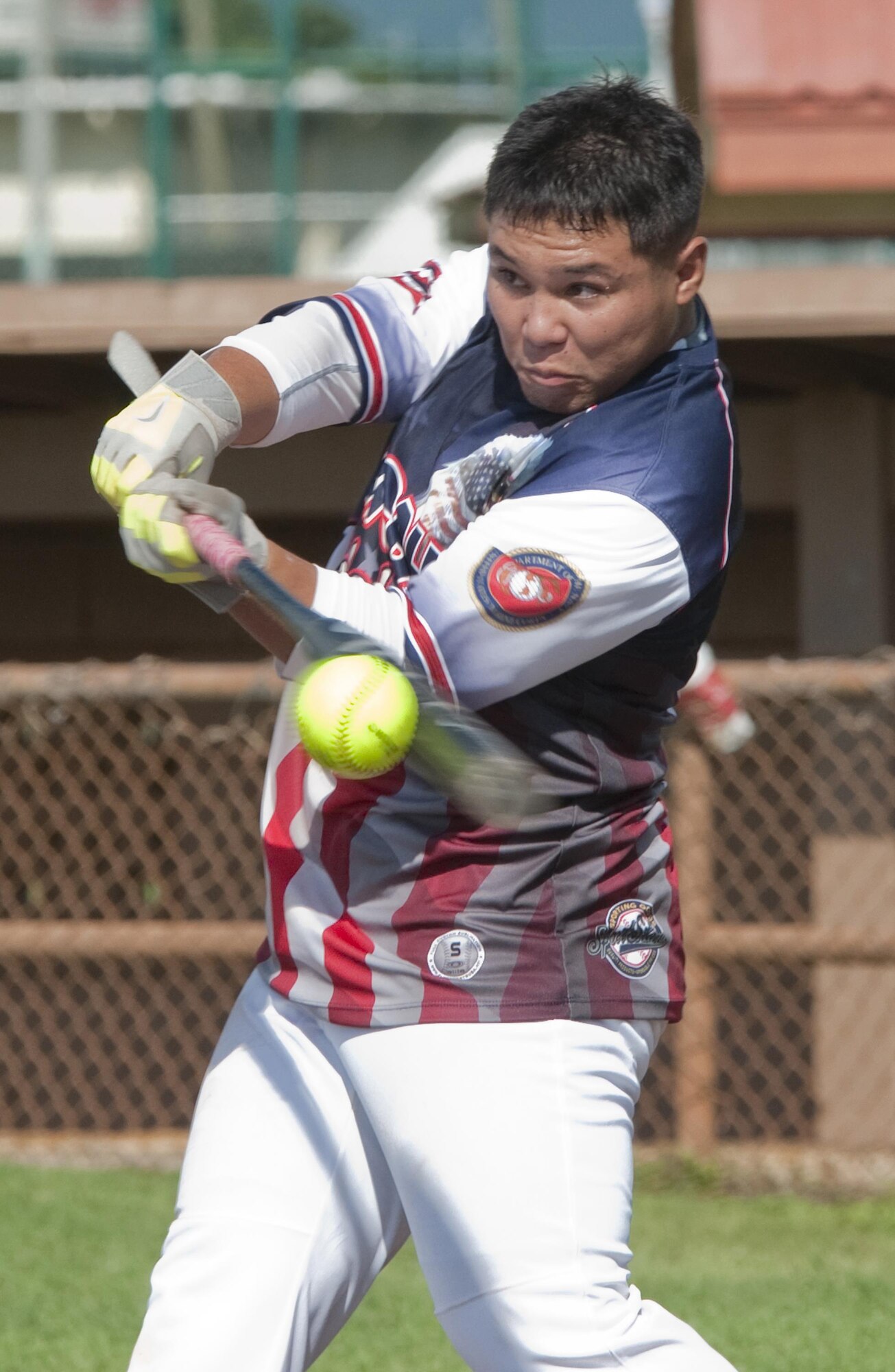 MARINE CORPS BASE HAWAII — Lance Cpl. Aaron Taoy, a supply clerk with Fourth Force Reconnaissance Company and native of Wahiawa, Hawaii, takes his turn at bat during an Armed Forces Softball Tournament game at Riseley Field, Aug. 29, 2015. The Rad team beat the Marine Corps Base team, 8-4. The Rad team beat the Marine Corps Base team, 8-4. Several of the teams were made up of service members from different branches, dependents and Department of Defense civilians. Overall, an Army team based out of Schofield Barracks in Wahiawa, Hawaii, took first place, and the Rad team took second. Recreational events such as the softball tournament help boost morale aboard Marine Corps Base Hawaii, furthering the mission, which is to provide better service for the units, individuals and families in order to enhance and sustain combat readiness for all operating forces and tenant organizations aboard the installation. (U.S. Marine Corps photo by Kristen Wong/Released) 