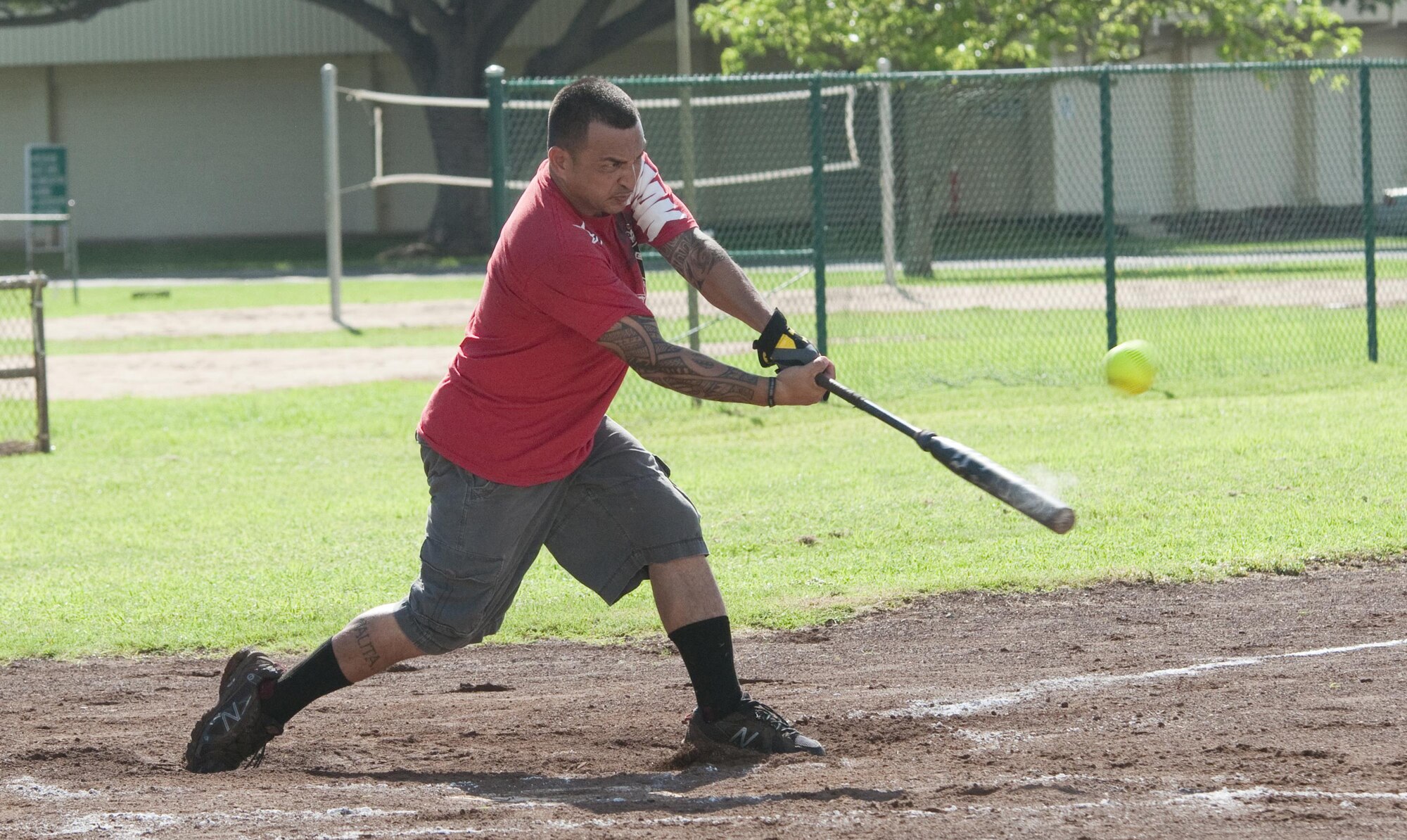 Rad player Francis St. Nicolas, of Kailua, Hawaii, attempts to make contact with the ball during an Armed Forces Softball Tournament game at Riseley Field, Aug. 29, 2015. The Rad team beat the Marine Corps Base team, 8-4. Several of the teams were made up of service members from different branches, dependents and Department of Defense civilians. Overall, an Army team based out of Schofield Barracks in Wahiawa, Hawaii, took first place, and the Rad team took second. Recreational events such as the softball tournament help boost morale aboard Marine Corps Base Hawaii, furthering the mission, which is to provide better service for the units, individuals and families in order to enhance and sustain combat readiness for all operating forces and tenant organizations aboard the installation. (U.S. Marine Corps photo by Kristen Wong/Released) 