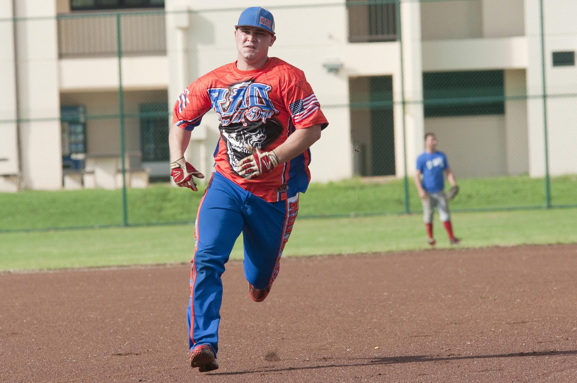 Rad player Sgt. Michael Morriss, a motor transport Marine with 1st Battalion, 12th Marine Regiment, and Texarkana, Texas, native, rounds second base during an Armed Forces Softball Tournament game at Riseley Field, Aug. 29, 2015. The Rad team beat the Marine Corps Base team, 8-4. Several of the teams were made up of service members from different branches, dependents and Department of Defense civilians. Overall, an Army team based out of Schofield Barracks in Wahiawa, Hawaii, took first place, and the Rad team took second. Recreational events such as the softball tournament help boost morale aboard Marine Corps Base Hawaii, furthering the mission, which is to provide better service for the units, individuals and families in order to enhance and sustain combat readiness for all operating forces and tenant organizations aboard the installation. (U.S. Marine Corps photo by Kristen Wong/Released) 