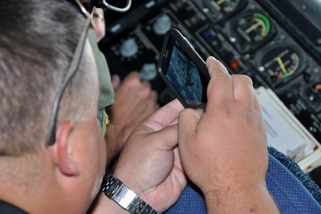 Jason Bullock of JPS Aviation takes a picture of a KC-135 Stratotanker refueling a B-52 Stratofortress during the 2015 307th Bomb Wing Civic Leader Tour Sept. 1-2, 2015. The tour gave 29 Louisiana civic leaders the opportunity to get a closer look at the mission of the Air Force Reserve during the two-day trip from Barksdale to Joint Base San Antonio and Dyess Air Force Base in Texas. The trip included a refueling of the B-52 and B-1 Lancer; a C-5 Galaxy and B-1 static tour; a visit to the Center for the Intrepid for wounded warriors; and networking with other local community leaders. (U.S. Air Force photo by Master Sgt. Mary Hinson/Released)