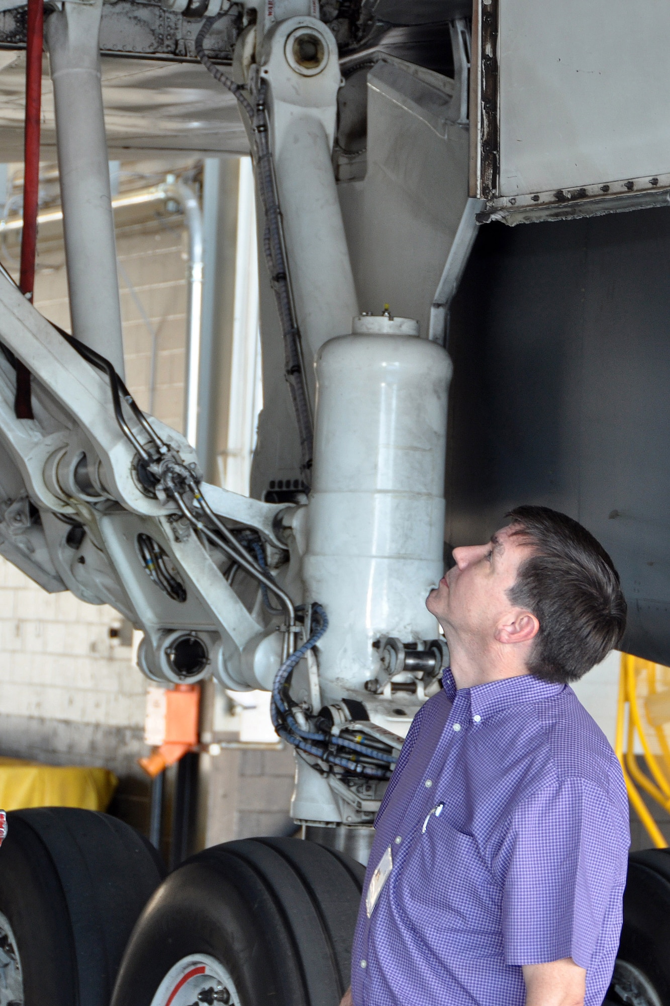 Gary Hubbard from Hubbard Investments examines the underneath of the B-1 Lancer at Dyess Air Force Base, Texas, during the 2015 307th Bomb Wing Civic Leader Tour Sept. 1-2, 2015.  The tour gave 29 Louisiana civic leaders the opportunity to get a closer look at the mission of the Air Force Reserve during the two-day trip from Barksdale to Joint Base San Antonio and Dyess Air Force Base in Texas. The trip included a refueling of the B-52 Stratofortress and B-1 Lancer; a C-5 Galaxy and B-1 static tour; a visit to the Center for the Intrepid for wounded warriors; and networking with other local community leaders. (U.S. Air Force photo by Master Sgt. Mary Hinson/Released)