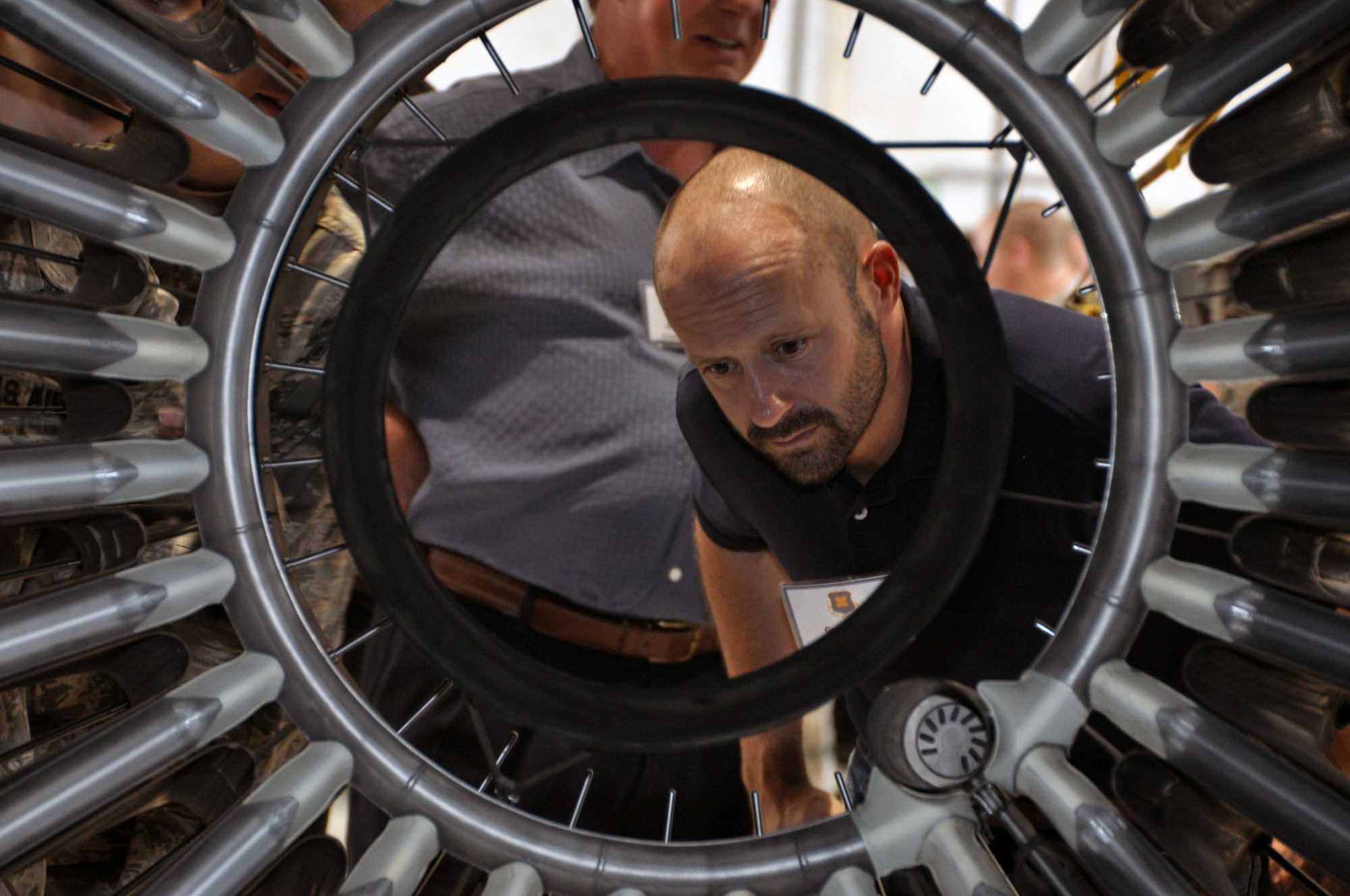 Greg Doyal of Home Federal Bank inspects the auger off of a B-1 Lancer in the engine shop at Dyess Air Force Base, Texas, during the 2015 307th Bomb Wing Civic Leader Tour Sept. 1-2, 2015.  The tour gave 29 Louisiana civic leaders the opportunity to get a closer look at the mission of the Air Force Reserve during the two-day trip from Barksdale to Joint Base San Antonio and Dyess Air Force Bases in Texas. The trip included a refueling of the B-52 Stratofortress and B-1 Lancer; a C-5 Galaxy and B-1 static tour; a visit to the Center for the Intrepid for wounded warriors; and networking with other local community leaders. (U.S. Air Force photo by Master Sgt. Mary Hinson/Released)