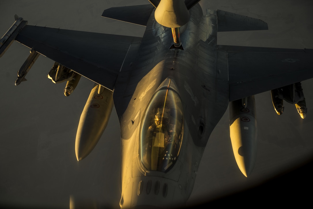 A U.S. Air Force F-16 Viper receives fuel from a KC-135R over Southwest Asia, Sept. 3, 2015. The KC-135R is assigned to the 340th Expeditionary Air Refueling Squadron. Coalition forces fly daily missions to support Operation Inherent Resolve. U.S. Air Force photo by Senior Airman Taylor Queen