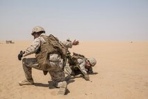 KUWAIT (Aug. 26, 2015) U.S. Marines Lance Cpl. Maurice Gardner, left, and Lance Cpl. Gary Gomez engage targets more than 500 meters away with an M224A1 60 mm mortar system during call-for-fire training. Gardner is an assistant gunner and Gomez is a gunner, both with Kilo Company, Battalion Landing Team 3rd Battalion, 1st Marine Regiment, 15th Marine Expeditionary Unit. During the training squad leaders sharpened their call-for-fire skills with mortarmen. Elements of the 15th MEU are ashore in Kuwait for sustainment training to maintain and enhance the skills they developed during their pre-deployment training period. The 15th MEU is embarked with the Essex Amphibious Ready Group and deployed to maintain regional security in the U.S. 5th Fleet area of operations. (U.S. Marine Corps photo by Sgt. Emmanuel Ramos/Released)