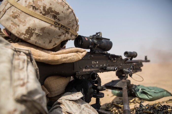 KUWAIT (Aug. 26, 2015) U.S. Marine Lance Cpl. Tyler Potter engages multiple targets at various distances during a machine gun marksmanship qualification course. Potter is a machine gunner with Kilo Company, Battalion Landing Team 3rd Battalion, 1st Marine Regiment, 15th Marine Expeditionary Unit. During the course of fire Marines had to accurately engage targets at various distances with limited ammunition. Elements of the 15th MEU are ashore in Kuwait for sustainment training to maintain and enhance the skills they developed during their pre-deployment training period. The 15th MEU is embarked with the Essex Amphibious Ready Group and deployed to maintain regional security in the U.S. 5th Fleet area of operations. (U.S. Marine Corps photo by Sgt. Emmanuel Ramos/Released)