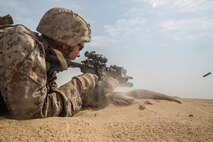 KUWAIT (Aug. 25, 2015) U.S. Marine Cpl. Willie Stevens engages targets during mechanized squad attack training. Stevens is a team leader with Kilo Company, Battalion Landing Team 3rd Battalion, 1st Marine Regiment, 15th Marine Expeditionary Unit. The training focused on the squad’s ability to work as a cohesive unit while using AAV-7 Amphibious Assault Vehicles and M1A1 Abrams tanks to effectively eliminate enemy targets. Elements of the 15th MEU are ashore in Kuwait for sustainment training to maintain and enhance the skills they developed during their pre-deployment training period. The 15th MEU is embarked with the Essex Amphibious Ready Group and deployed to maintain regional security in the U.S. 5th Fleet area of operations. (U.S. Marine Corps photo by Sgt. Emmanuel Ramos/Released)
