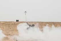 KUWAIT (Aug. 25, 2015) U.S. Marine Lance Cpl. Matthew Kobylarz clears a lane for his squad during mechanized squad attack training. Kobylarz is an assault team leader with Kilo Company, Battalion Landing Team 3rd Battalion, 1st Marine Regiment, 15th Marine Expeditionary Unit. The training focused on the squad’s ability to work as a cohesive unit while using AAV-7 Amphibious Assault Vehicles and M1A1 Abrams tanks to effectively eliminate enemy targets. Elements of the 15th MEU are ashore in Kuwait for sustainment training to maintain and enhance the skills they developed during their pre-deployment training period.  The 15th MEU is embarked with the Essex Amphibious Ready Group and deployed to maintain regional security in the U.S. 5th Fleet area of operations. (U.S. Marine Corps photo by Sgt. Emmanuel Ramos/Released)