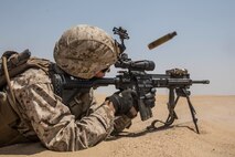 KUWAIT (Aug. 24, 2015) U.S. Marine Lance Cpl. Travis McGray engages targets during mechanized squad attack training. McGray is an automatic rifleman with Kilo Company, Battalion Landing Team 3rd Battalion, 1st Marine Regiment, 15th Marine Expeditionary Unit (MEU). The training focused on the squad’s ability to effectively utilize AAV-7 Amphibious Assault Vehicles and M1A1 Abrams tanks to close with and destroy enemy targets. Elements of the 15th MEU are ashore in Kuwait for sustainment training to maintain and enhance the skills they developed during their pre-deployment training period.  The 15th MEU is embarked with the Essex Amphibious Ready Group and deployed to maintain regional security in the U.S. 5th Fleet area of operations. (U.S. Marine Corps photo by Sgt. Emmanuel Ramos/Released)