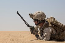 KUWAIT (Aug. 24, 2015) U.S. Marine Sgt. Daniel Davis coordinates machine gun fire with amphibious assault crewmen during mechanized squad attack training. Davis is a squad leader with Kilo Company, Battalion Landing Team 3rd Battalion, 1st Marine Regiment, 15th Marine Expeditionary Unit (MEU). The training focused on the squad’s ability to effectively utilize AAV-7 Amphibious Assault Vehicles and M1A1 Abrams tanks to close with and destroy enemy targets. Elements of the 15th MEU are ashore in Kuwait for sustainment training to maintain and enhance the skills they developed during their pre-deployment training period.  The 15th MEU is embarked with the Essex Amphibious Ready Group and deployed to maintain regional security in the U.S. 5th Fleet area of operations. (U.S. Marine Corps photo by Sgt. Emmanuel Ramos/Released)
