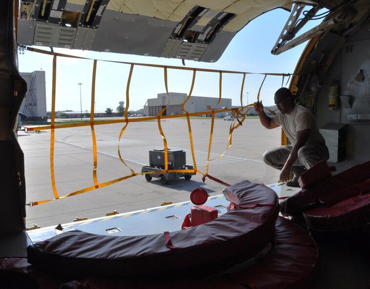 Senior Airman Orlando Misaalefua, 22nd Aircraft Maintenance Squadron crew chief, helps a 931st Air Refueling Group aircrew before a flight to refuel the U.S. Air Force Thunderbirds Air Force Demonstration Team Sept. 3, 2015, at McConnell Air Force Base, Kan.  Four members of Team McConnell performed the mission in a six-hour time frame.  (U.S. Air Force photo by Tech. Sgt. Abigail)