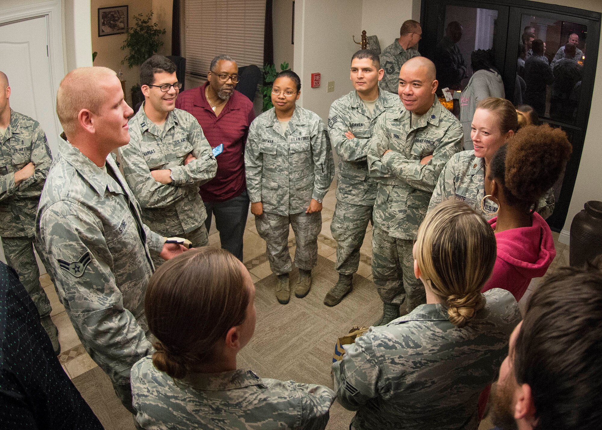 Airman 1st Class Spencer Stone, the Airman who helped foil a terrorist attack on a train in France Aug. 21, speaks with members of Travis Air Force Base, California after arriving at the base Sept. 3. Stone was greeted by hundreds of Airmen and their families including Col. Joel Jackson, 60th Air Mobility Wing commander and Chief Master Sgt. Alan Boling, 60th AMW Command Chief. He will receive continued medical treatment for his injuries at David Grant USAF Medical Center. (U.S. Air Force photo/T.C. Perkins) 
