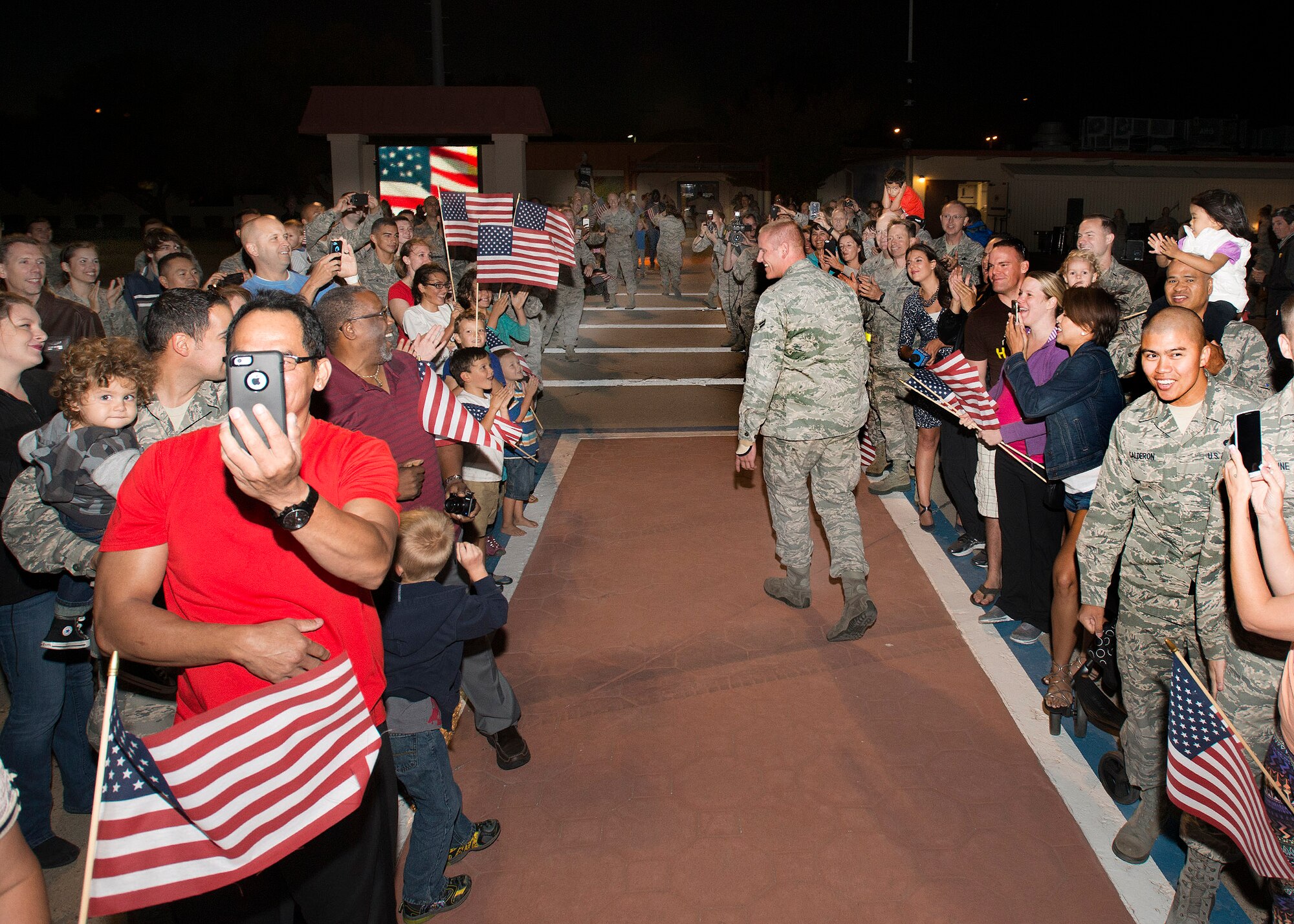 Airman 1st Class Spencer Stone, the Airman who helped foil a terrorist attack on a train in France Aug. 21, arrives at Travis Air Force Base, California Sept. 3. Stone was greeted by hundreds of Airmen including Col. Joel Jackson, 60th Air Mobility Wing commander and Chief Master Sgt. Alan Boling, 60th AMW Command Chief.  He will receive continued medical treatment for his injuries at David Grant USAF Medical Center. (U.S. Air Force photo/T.C. Perkins)